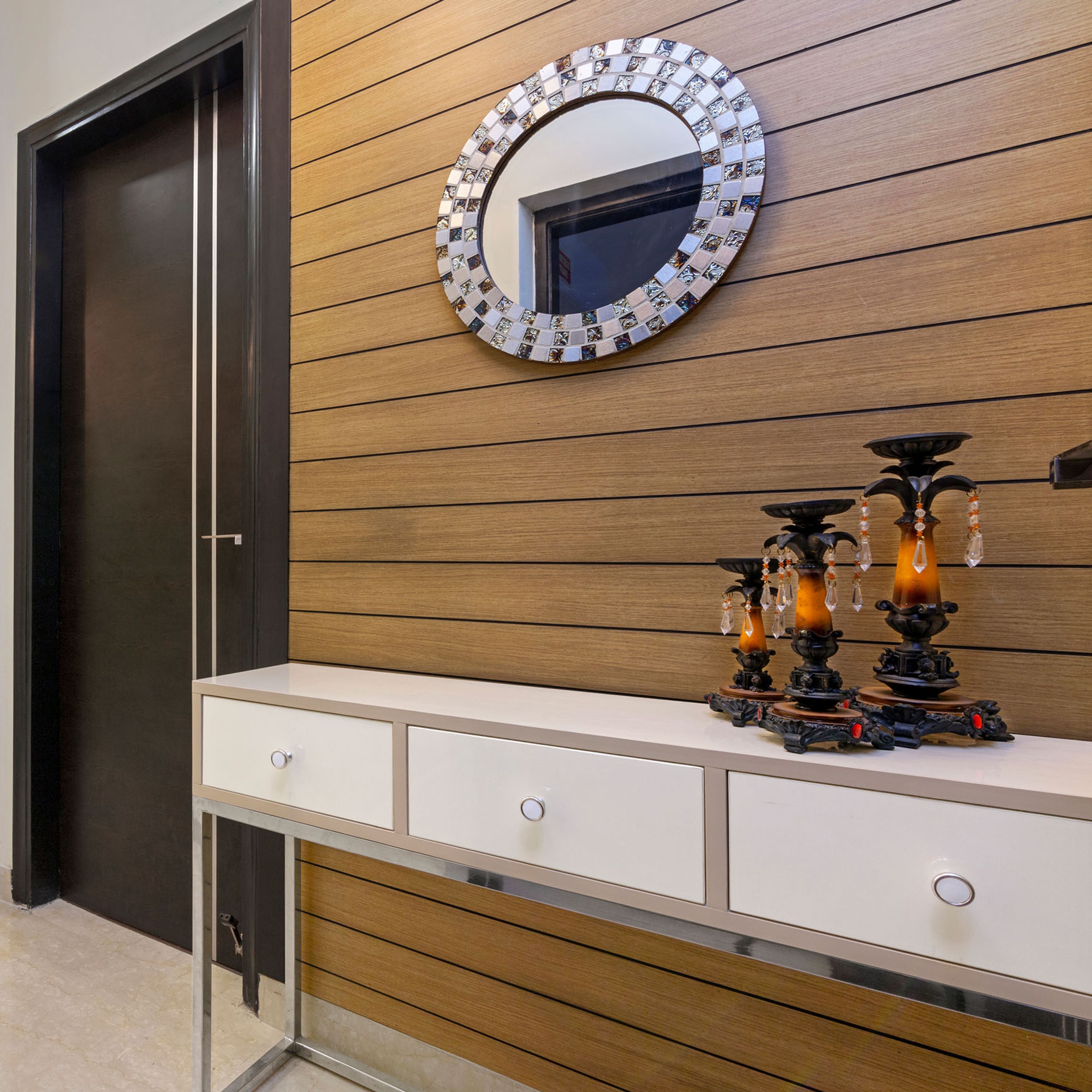 Wood And White Foyer Design With Round Mirror - Livspace