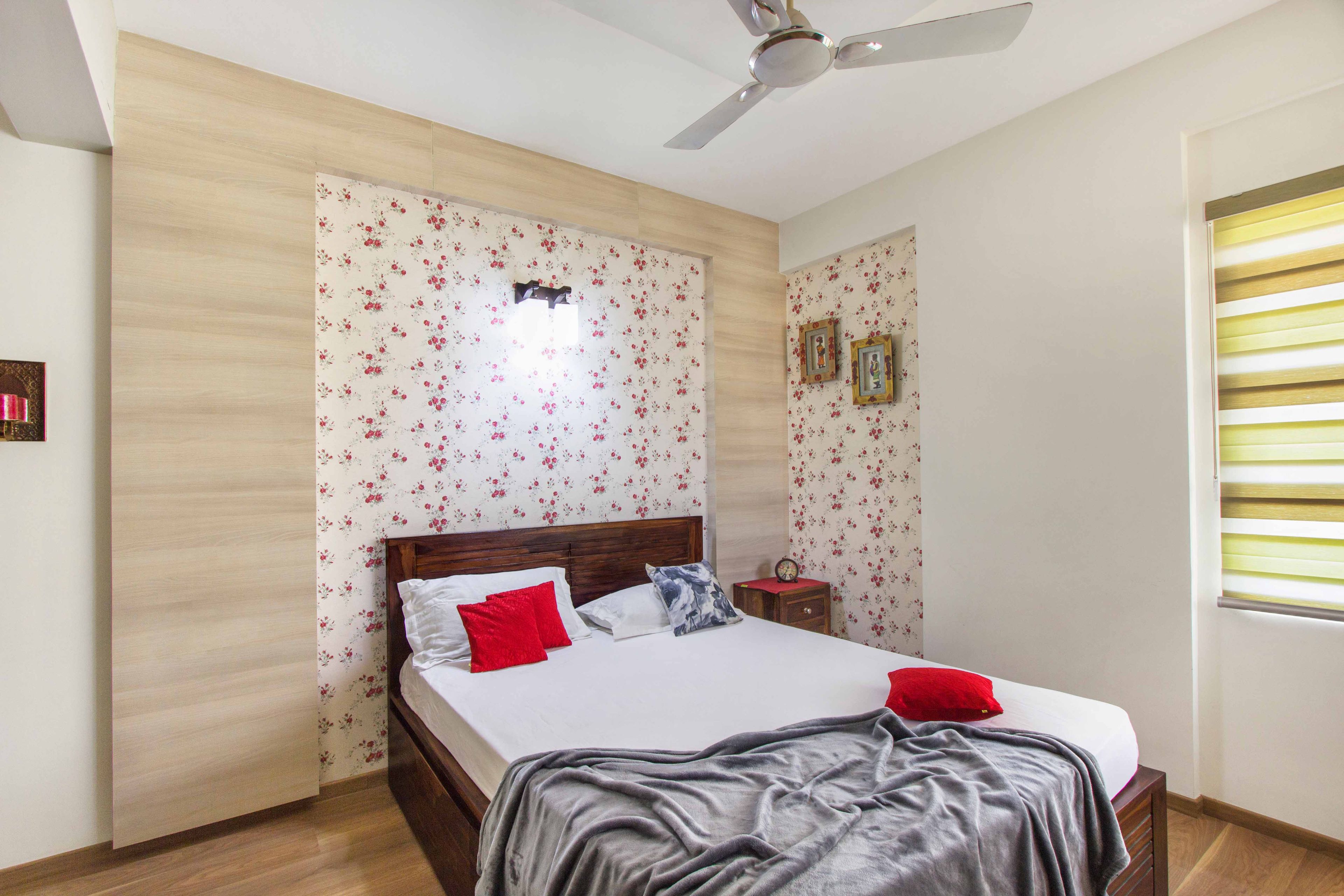 Master Bedroom Design with Wooden Headboard and Flower Theme Wallpaper - Livspace