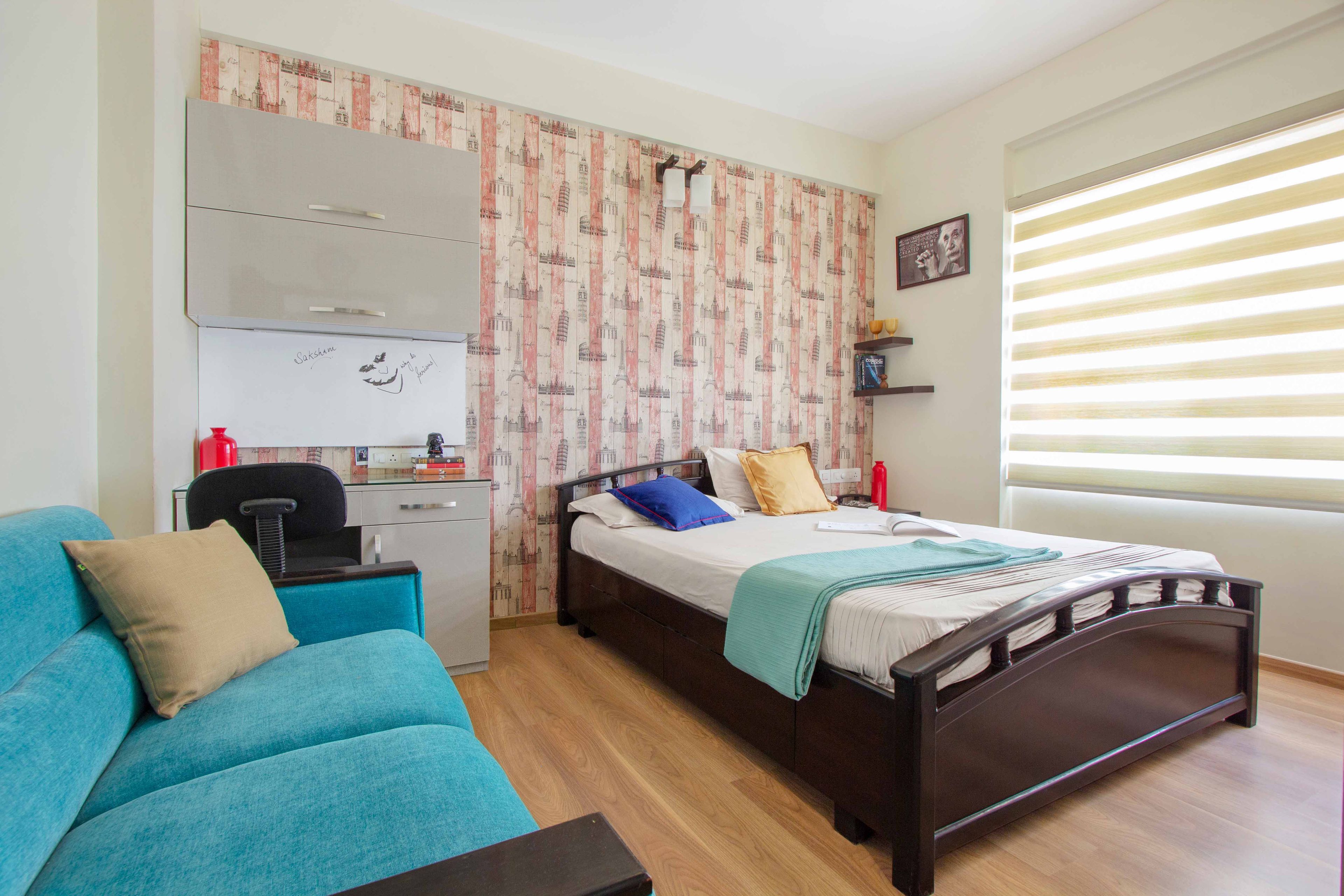 Kids Bedroom Design with Dark Wooden Bed and Monuments Theme Wallpaper with Study Unit and Chair - Livspace