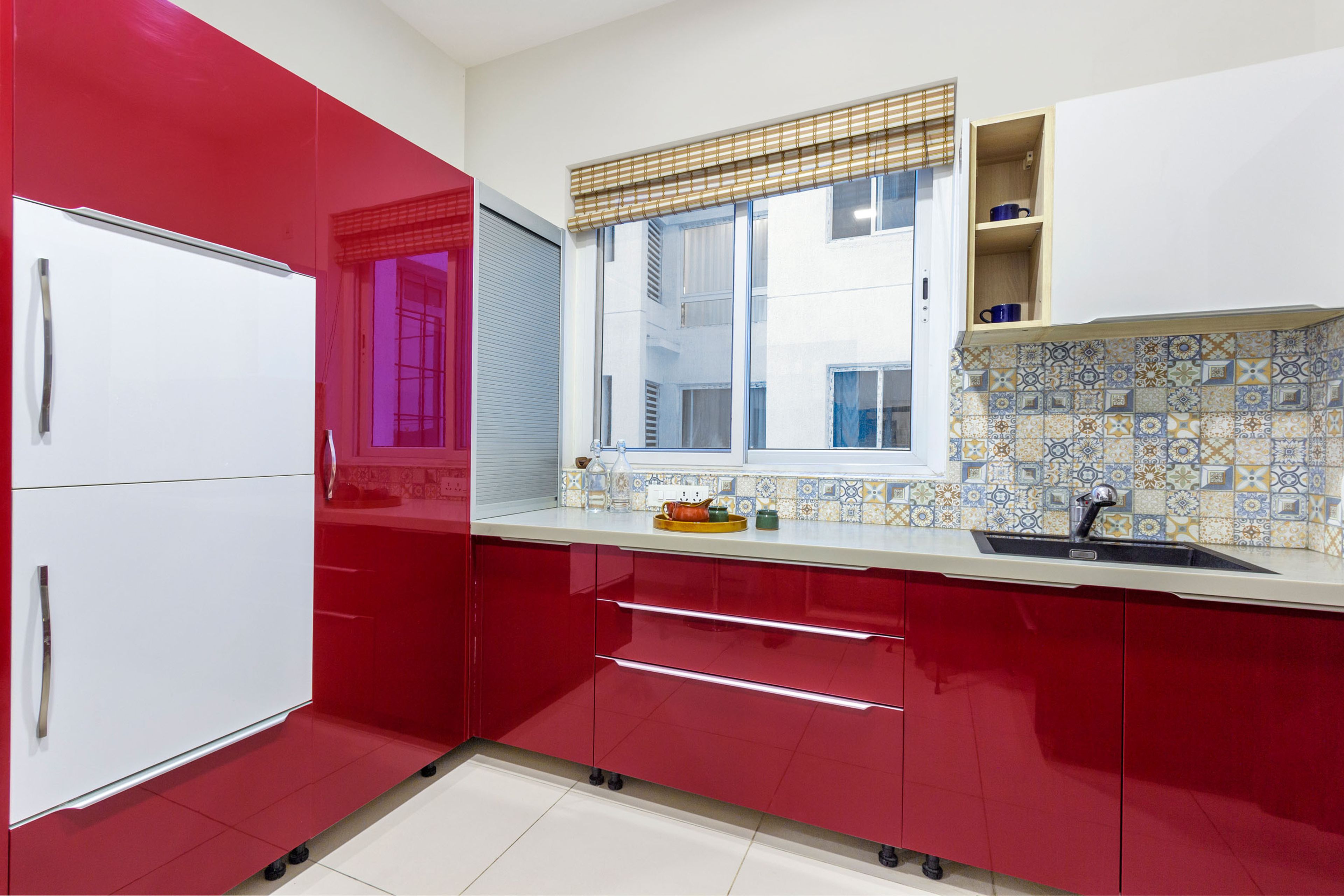 Kitchen Design with Red and White Tall Units and Cabinets