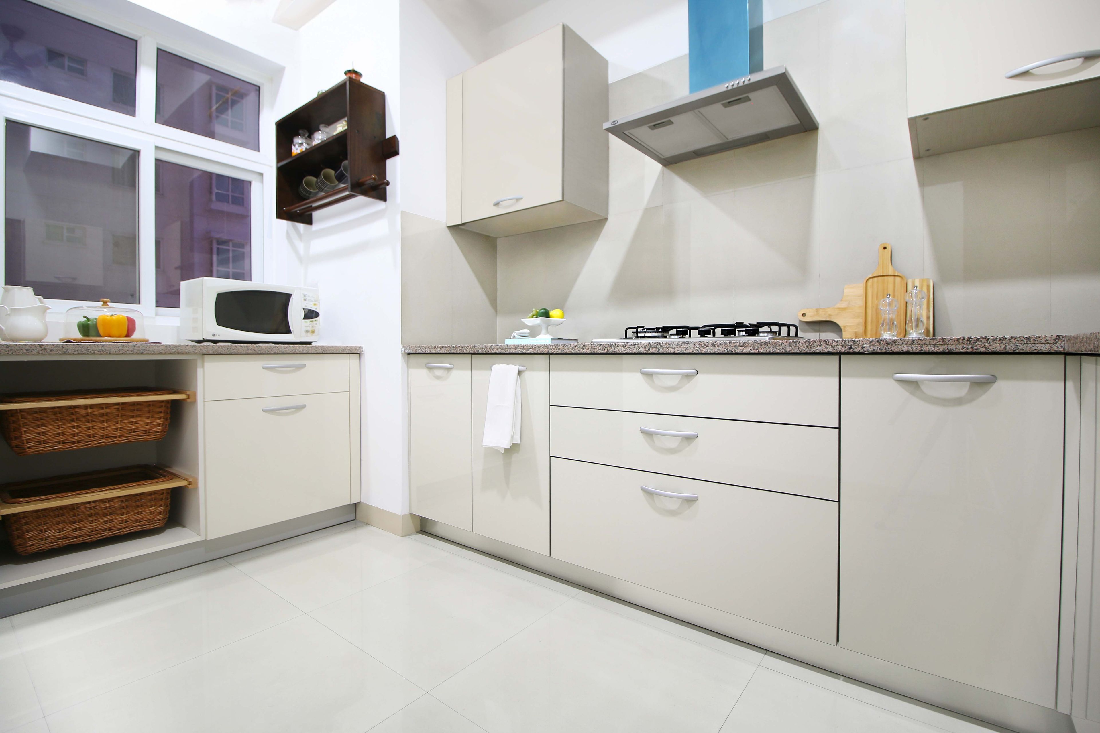 Contemporary 2-BHK Flat Interior Decoration With L-Shaped Cream-Toned Modular Kitchen In Gurgaon