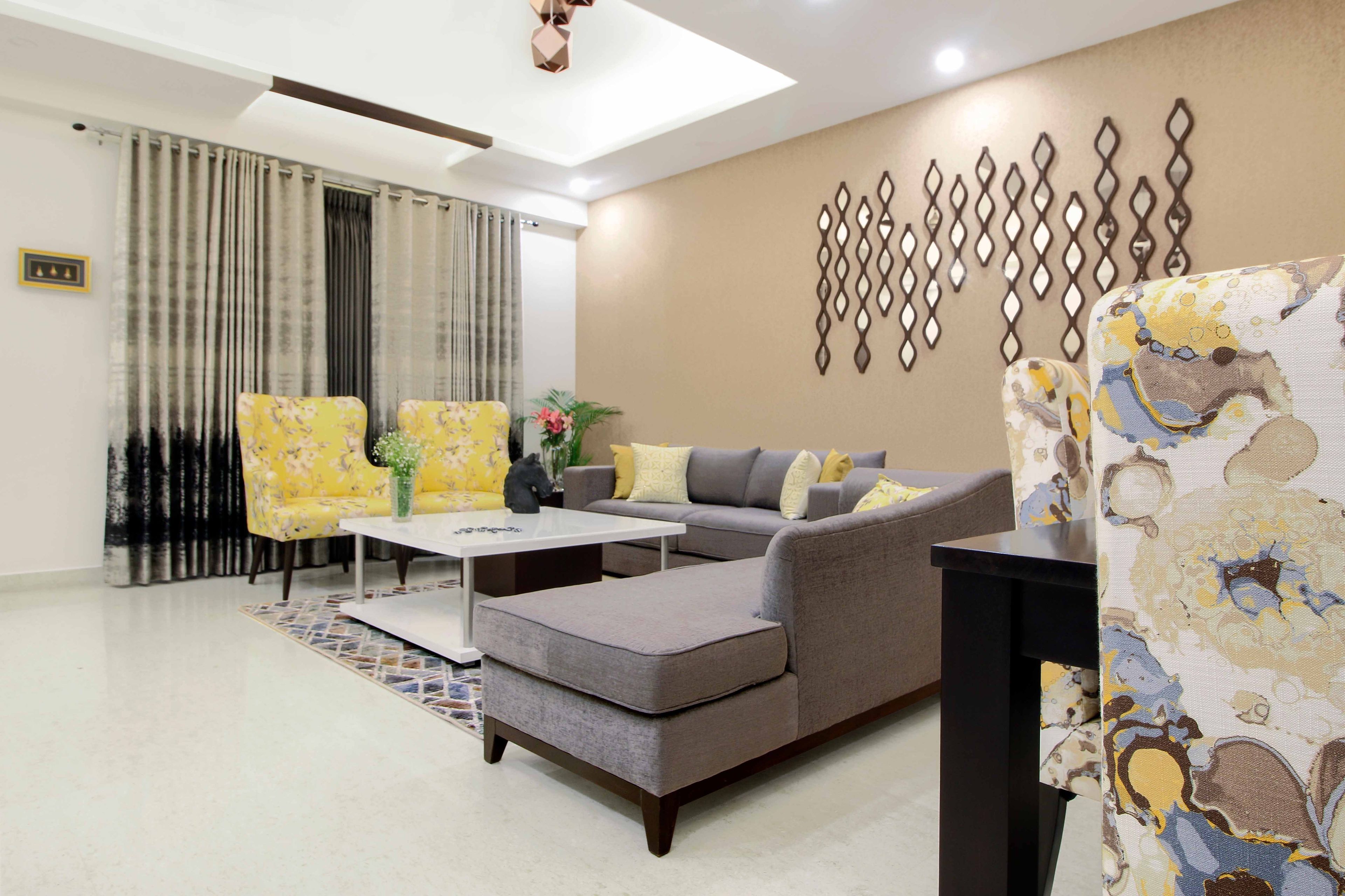 Grey And Yellow Living Room Design With Light Brown Wall And Mirrored Wall Work - Livspace