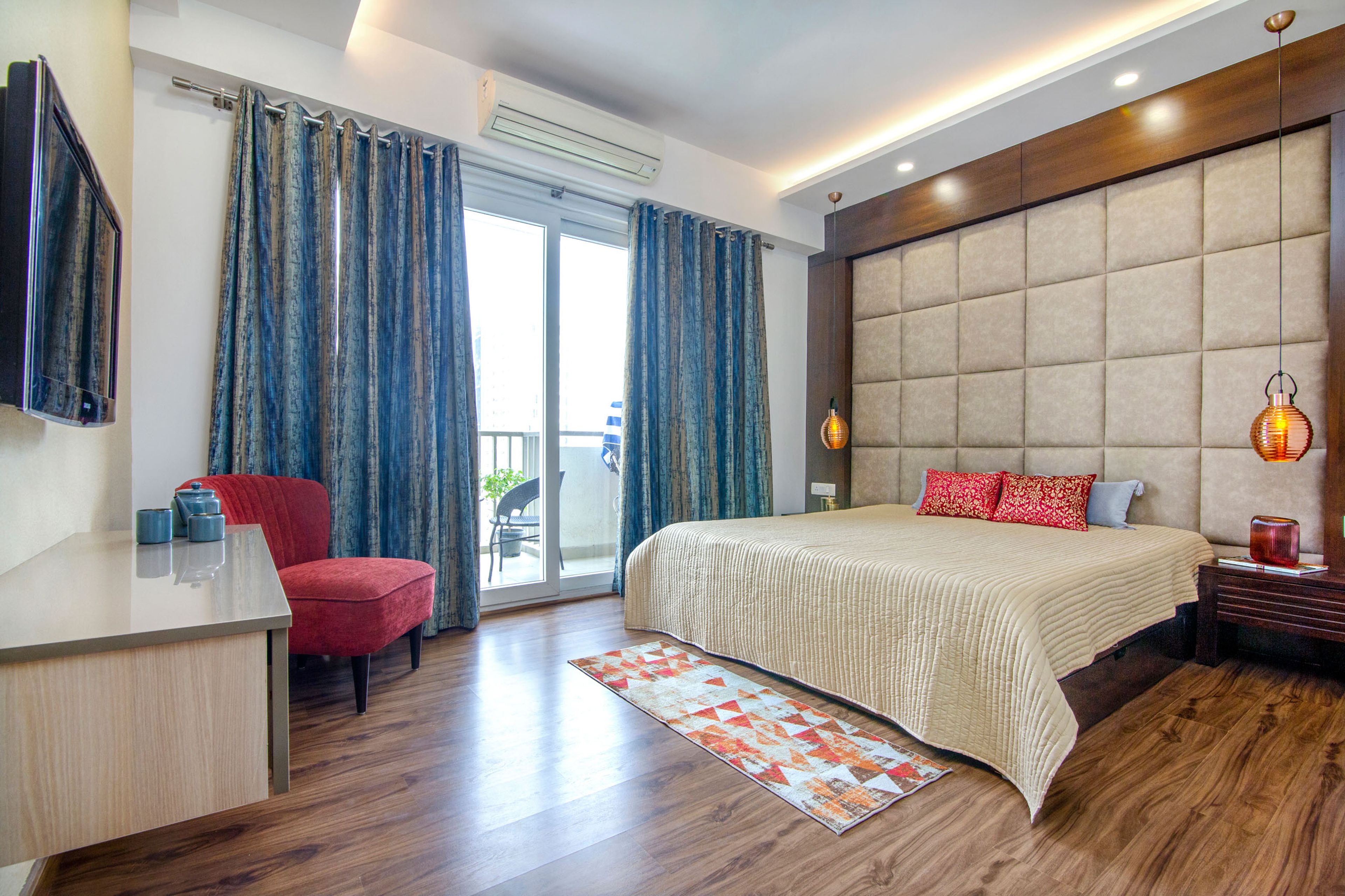 Master Bedroom With Floor-To-Ceiling Panelle Beige Headboard Wall And TV Unit - Livspace