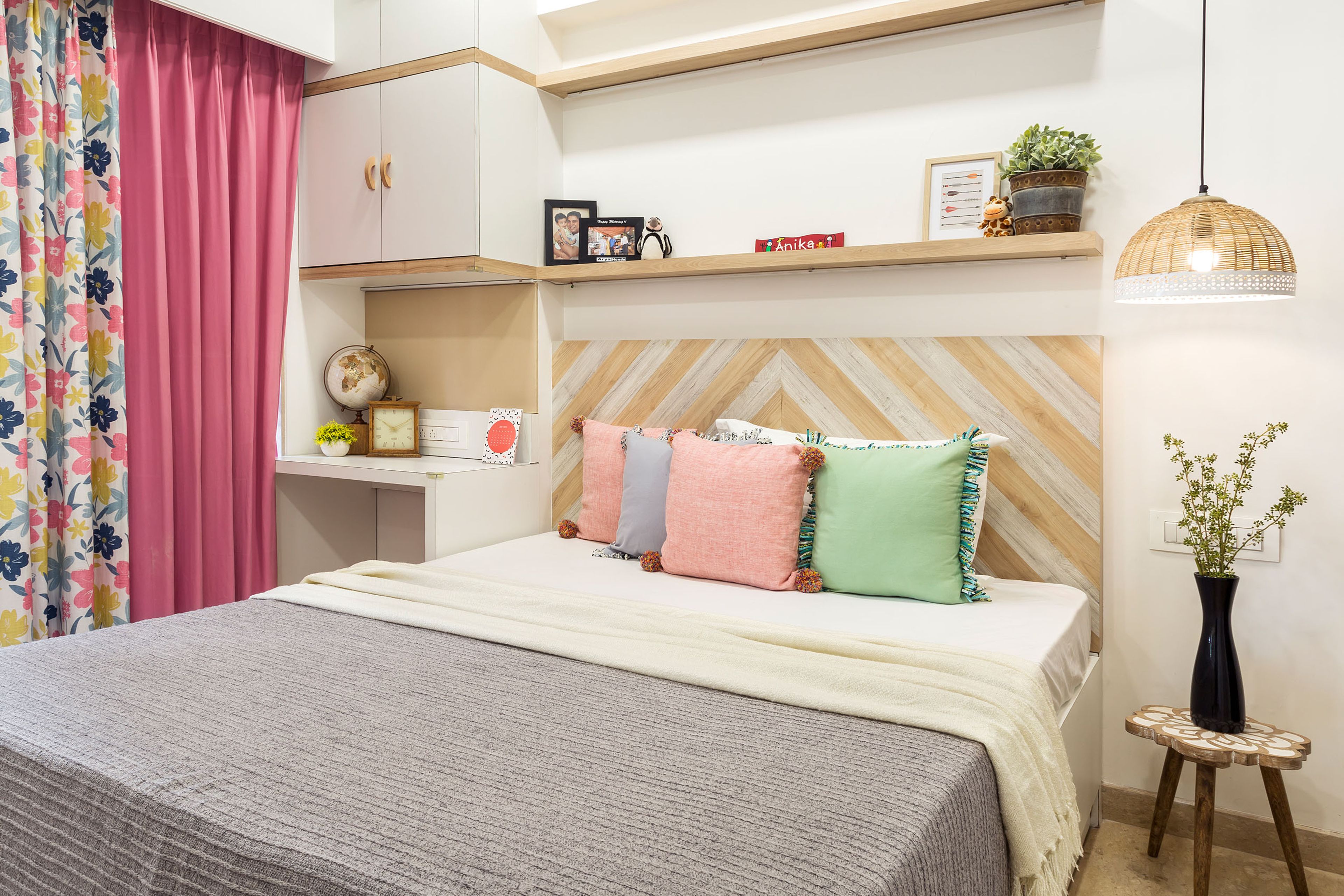 Modern Kids Room Design For Girls With Dual-Toned Headboard And White Study Table