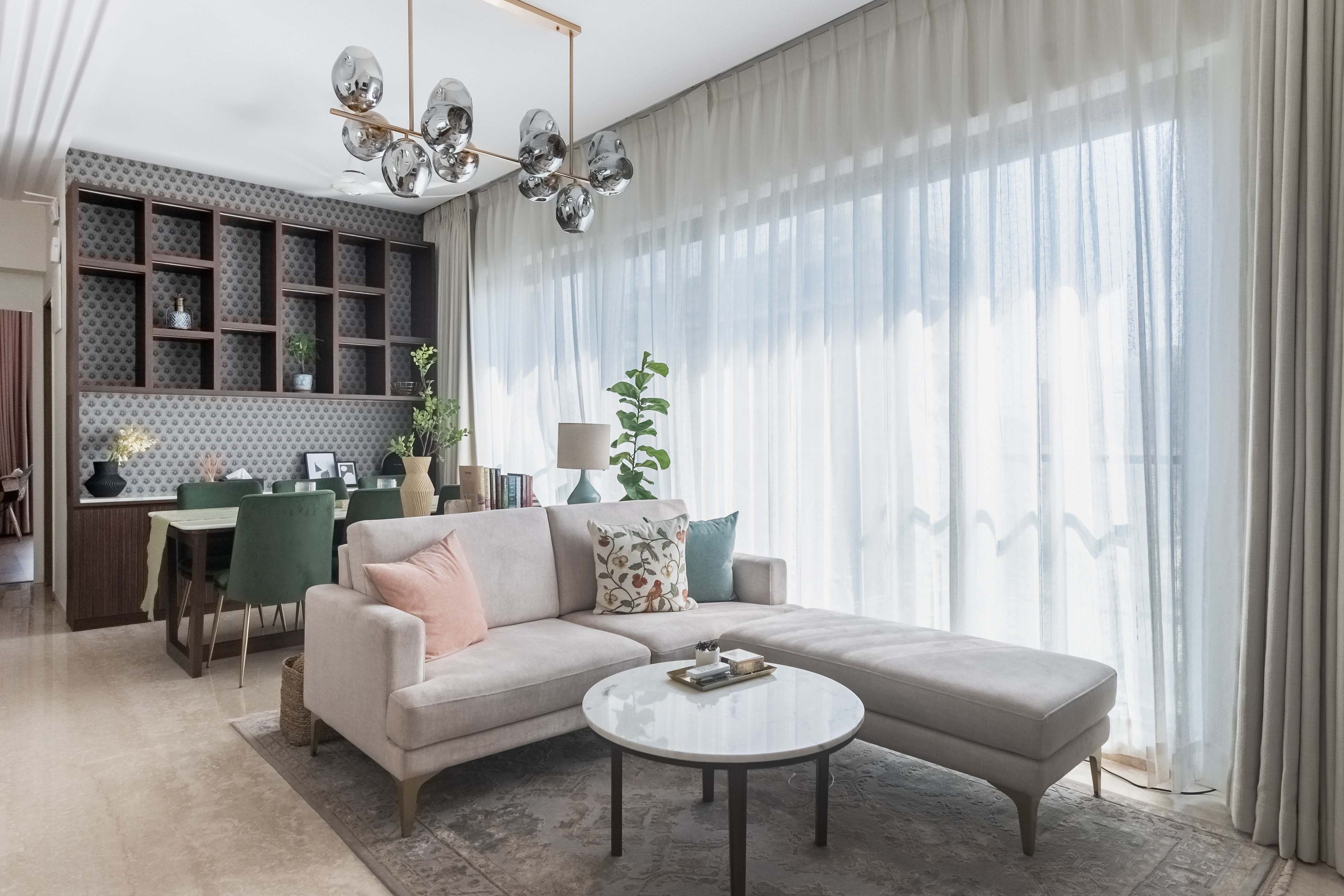 Living Room Design With Beige Sectional Sofa, 6-Seater Dining Table And Large Wooden Storage Unit - Livspace