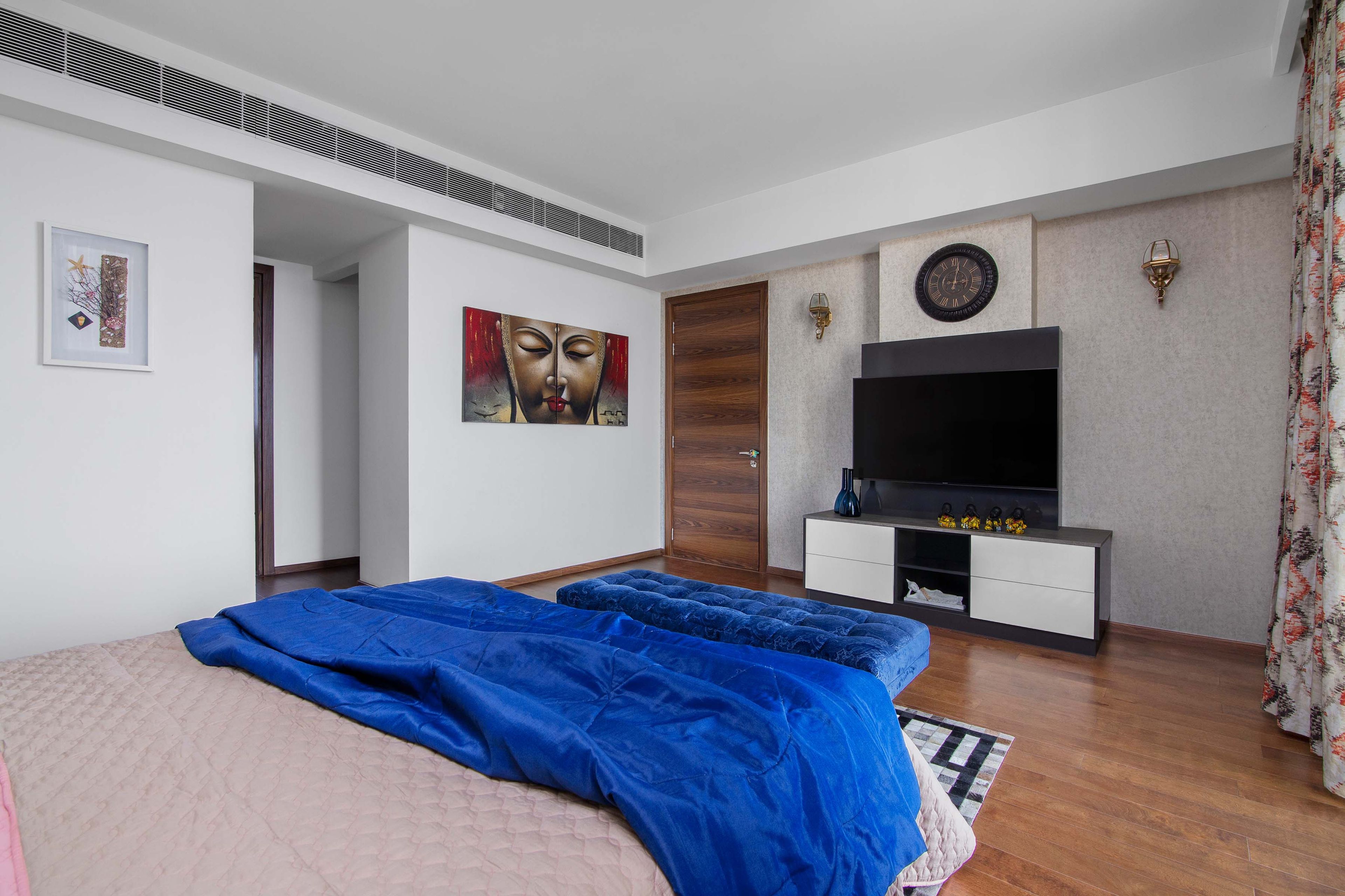 Master Bedroom With Black And White TV Unit And Beige Damask Wallpaper - Livspace