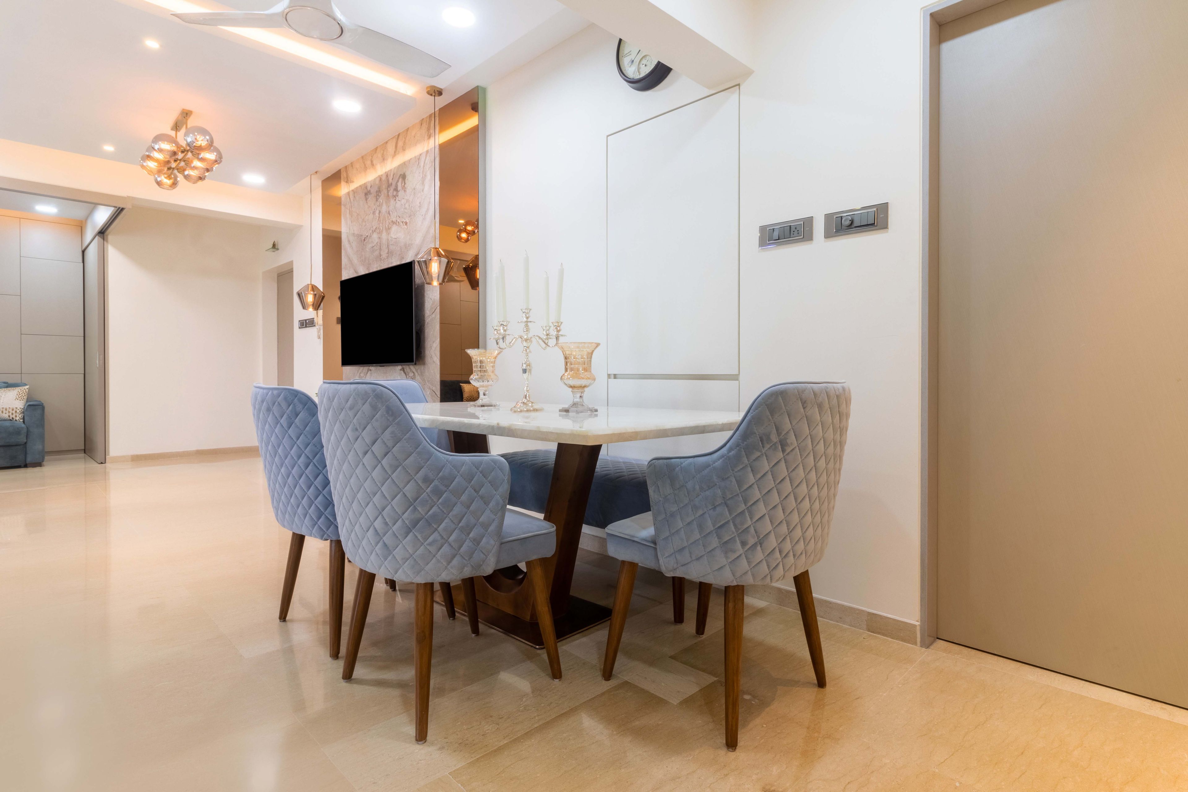 Mid-Century Modern White And Wood 4-Seater Dining Room Design With Blue Chairs And Seater