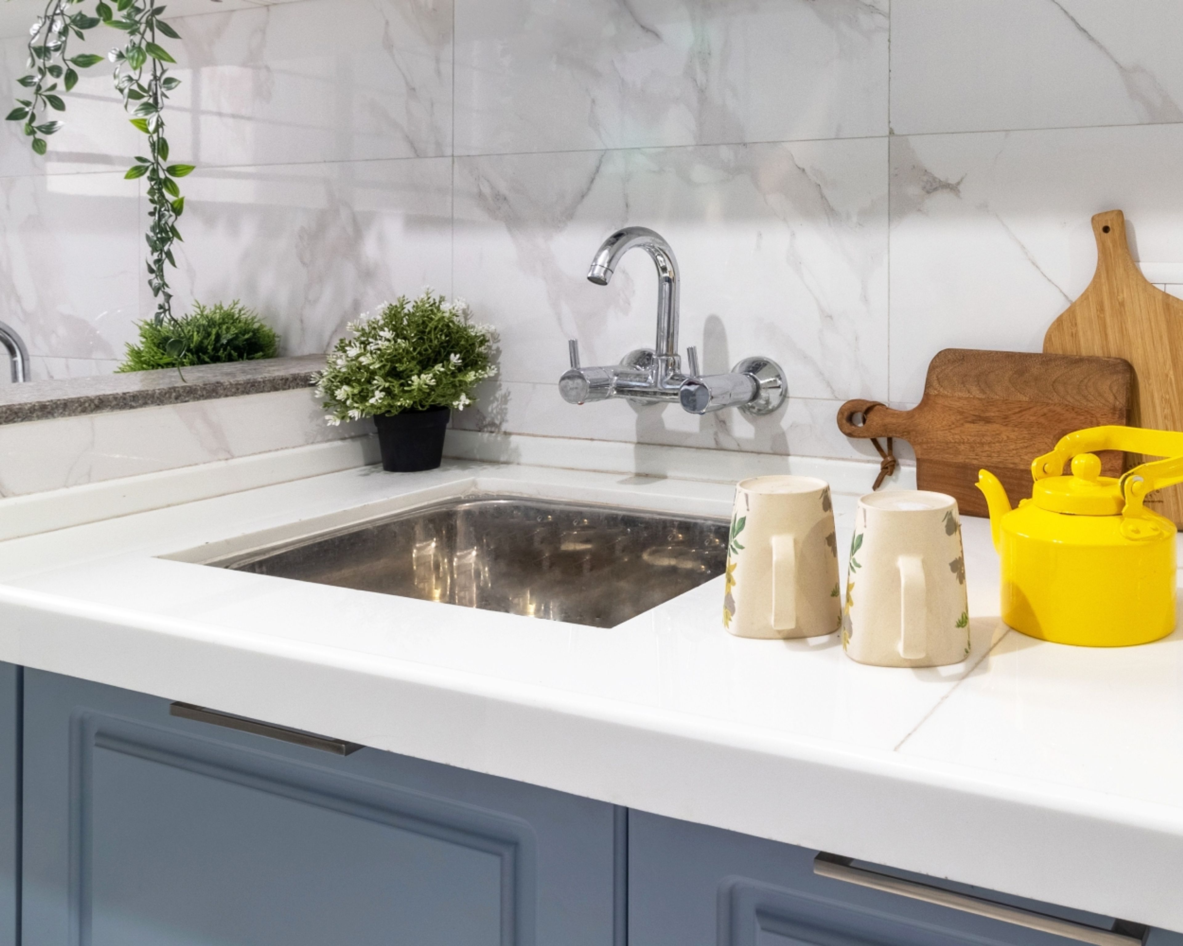 Contemporary Square Stainless Steel Kitchen Sink With White Countertop And Blue Cabinets