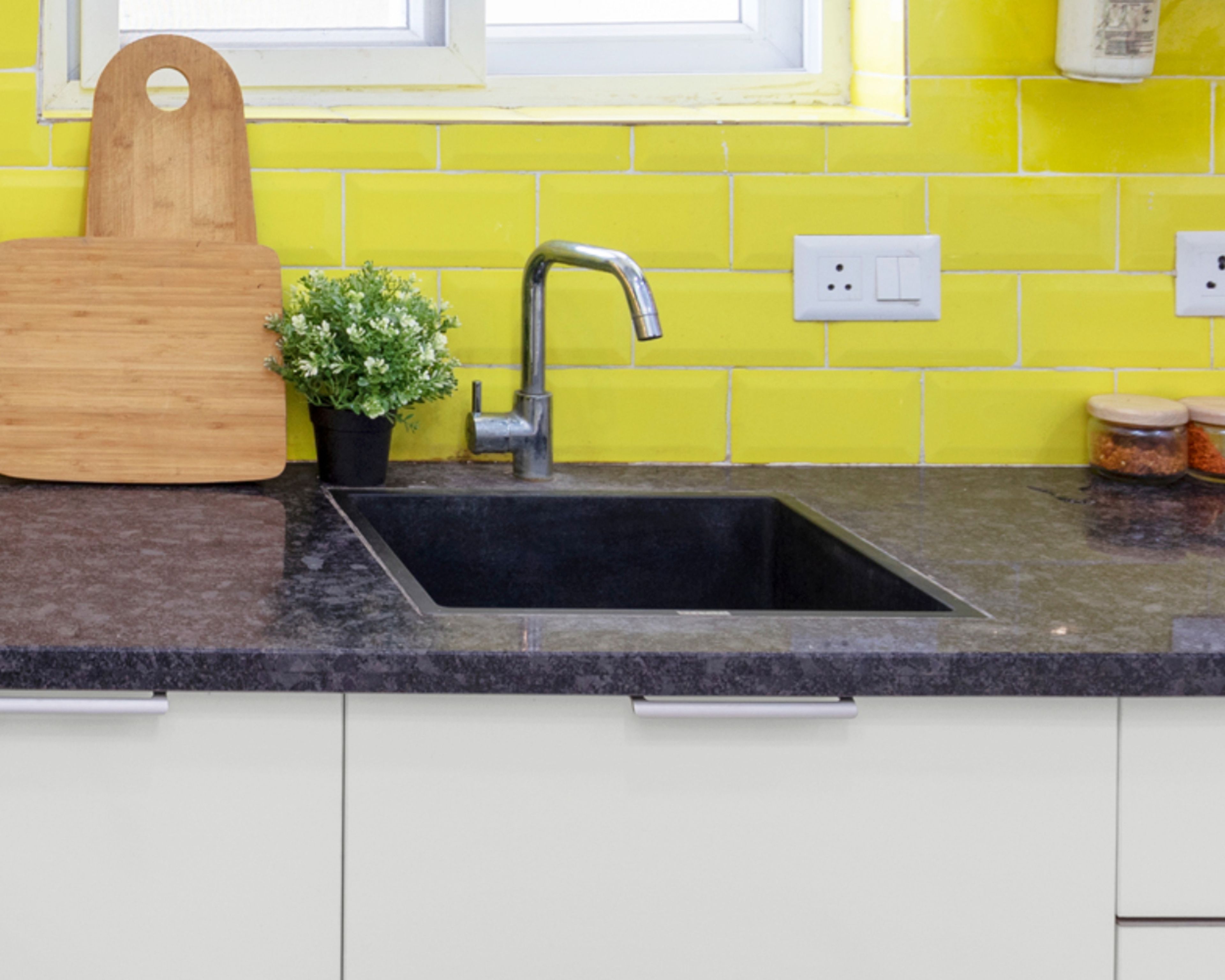 Modern Black Quartz Undermount Kitchen Sink Design With Bright Yellow Backsplash