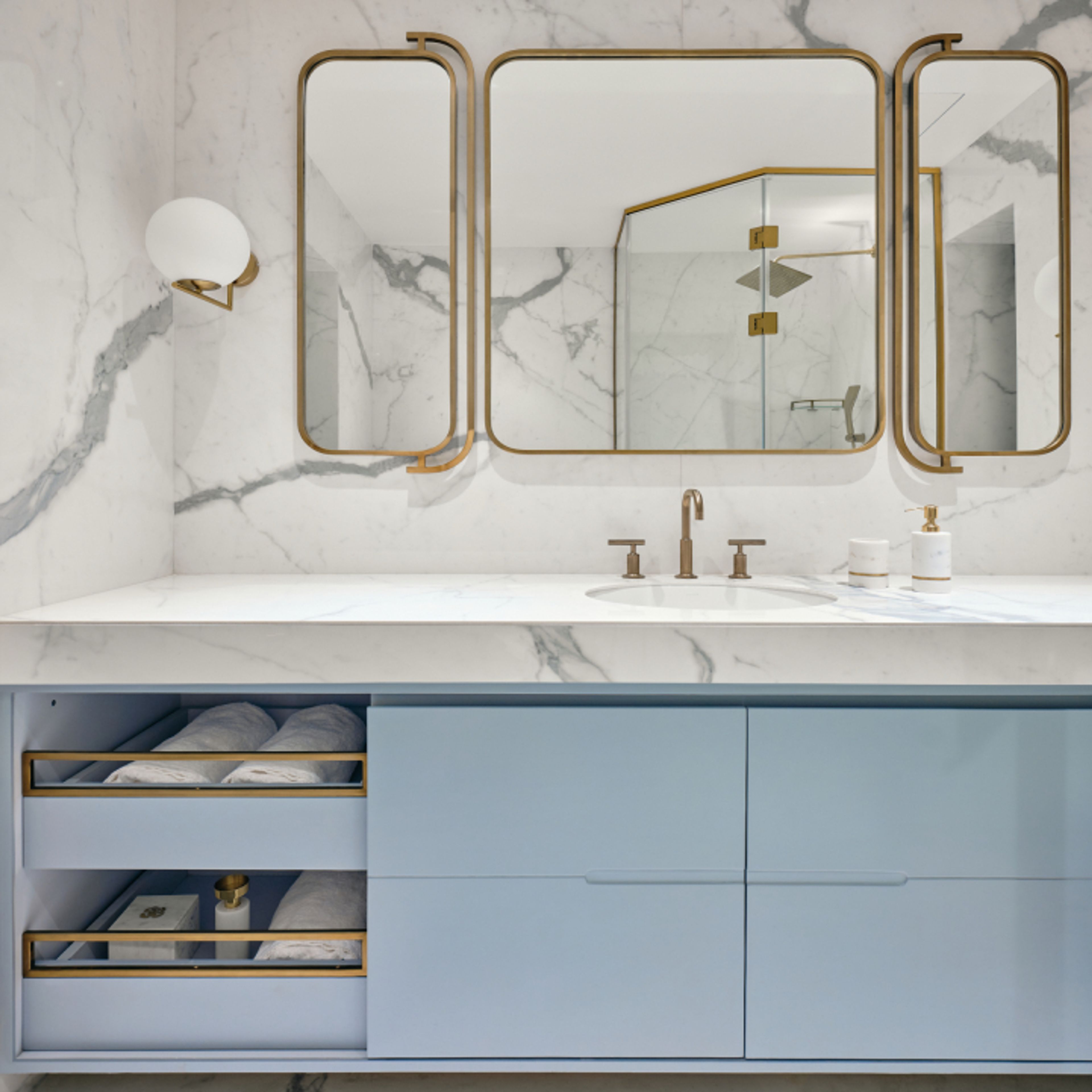 Contemporary Bathroom Design With White Marble Tiles And Blue Vanity Unit