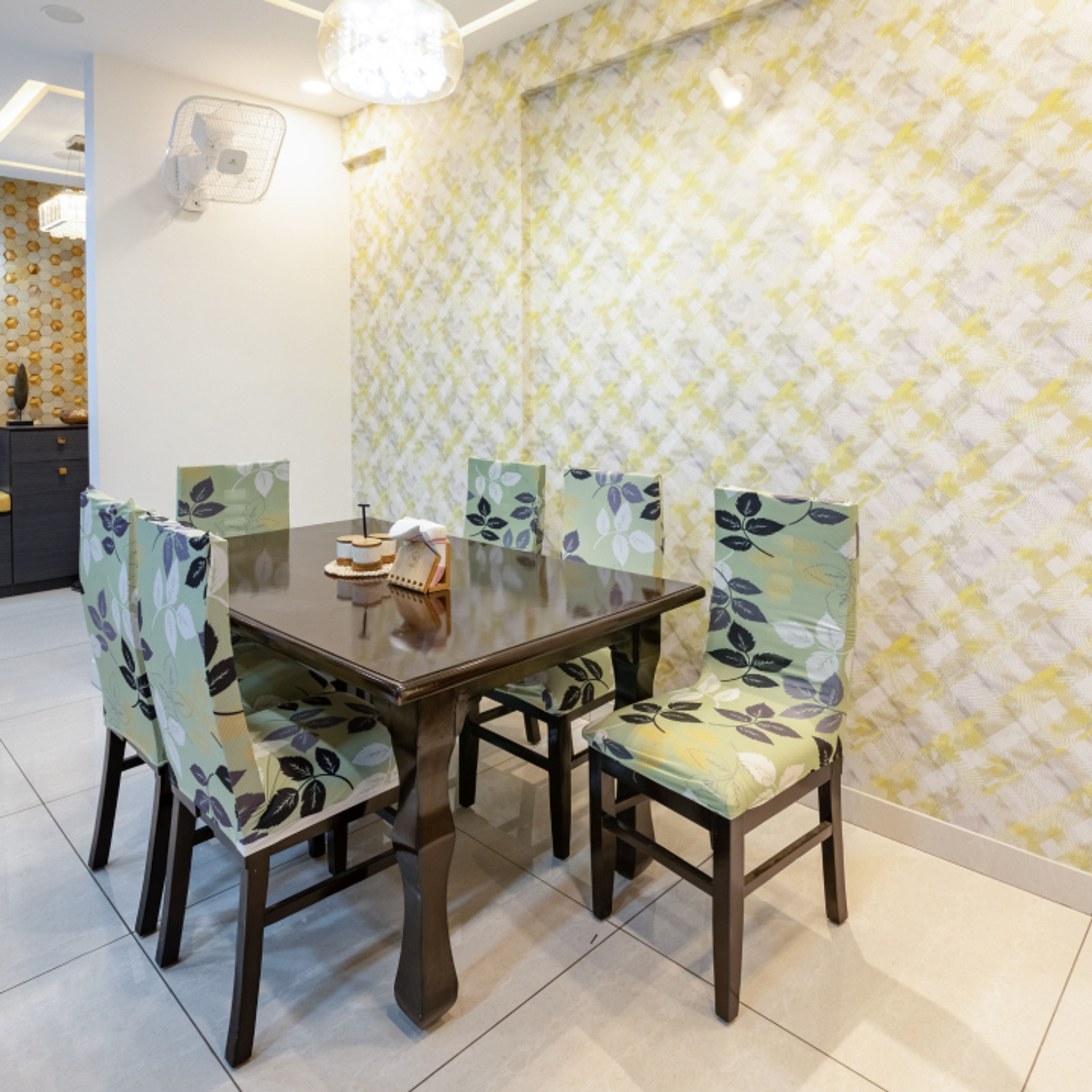 6-Seater Dining Room Design With Pastel Green Floral Upholstered Chairs - Livspace