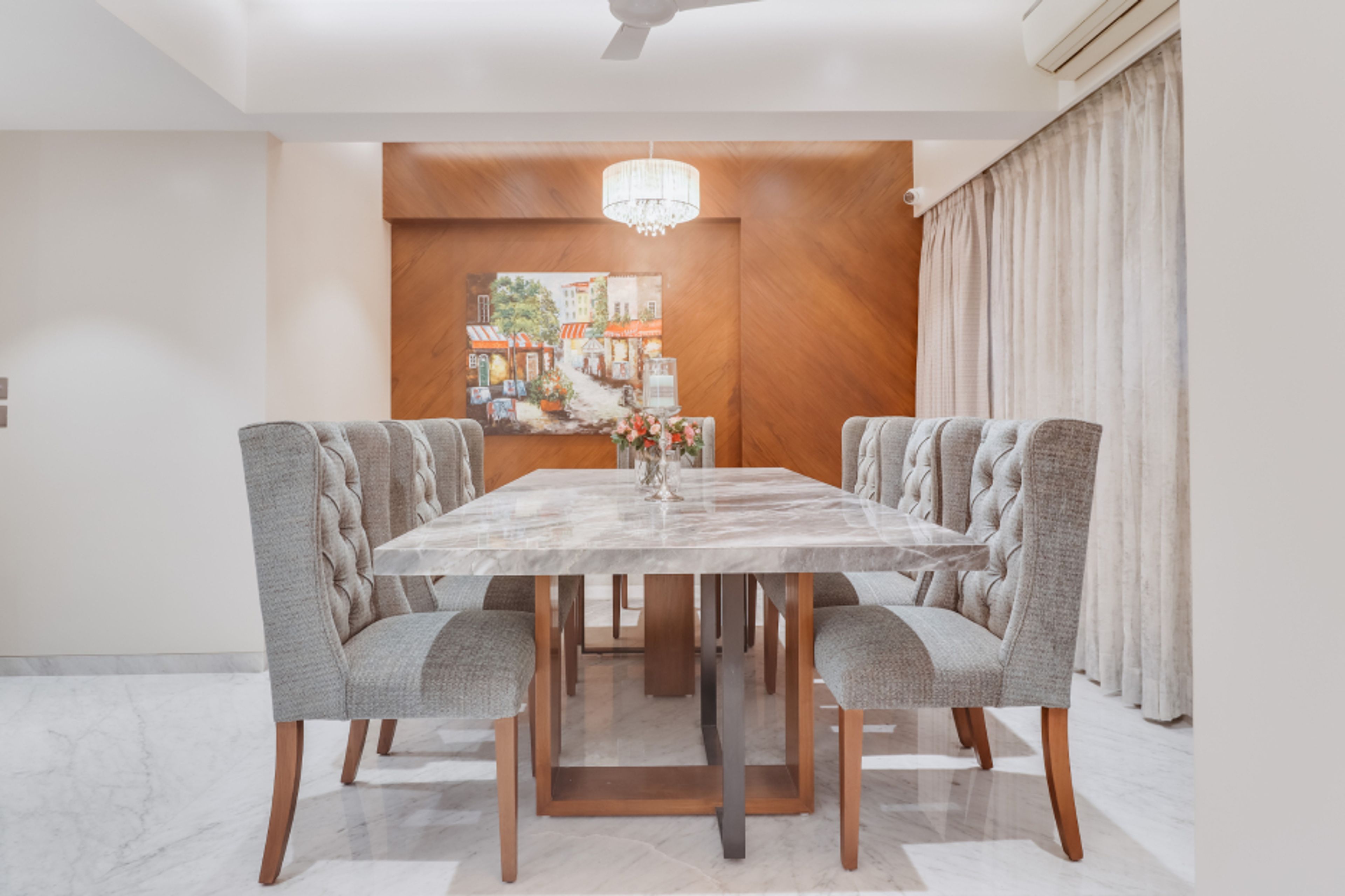 6-Seater Dining Room Design With A Marble Tabletop And Matching Grey Chairs - Livspace