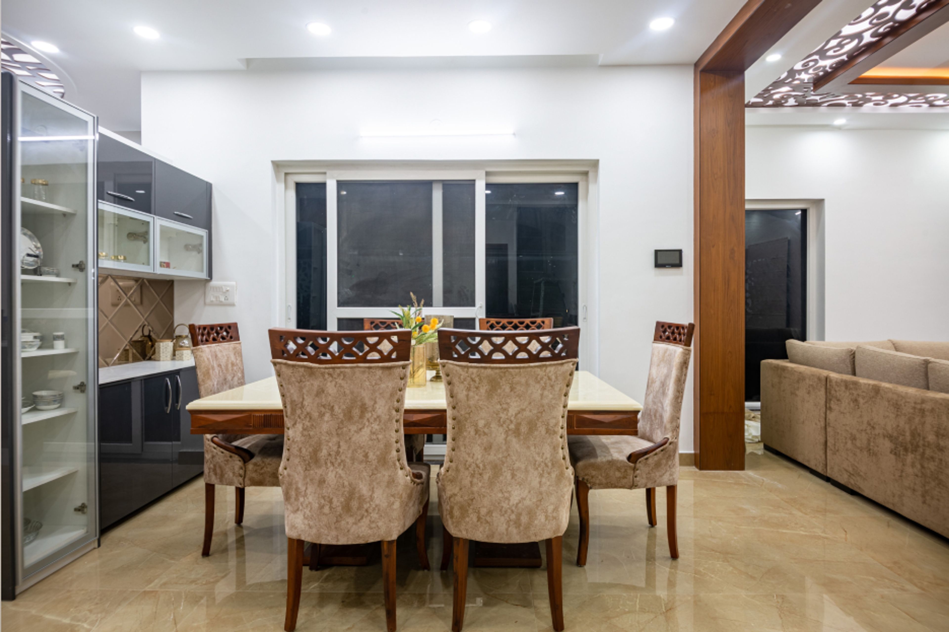 6-Seater Dining Room Design With Wall Shelves - Livspace