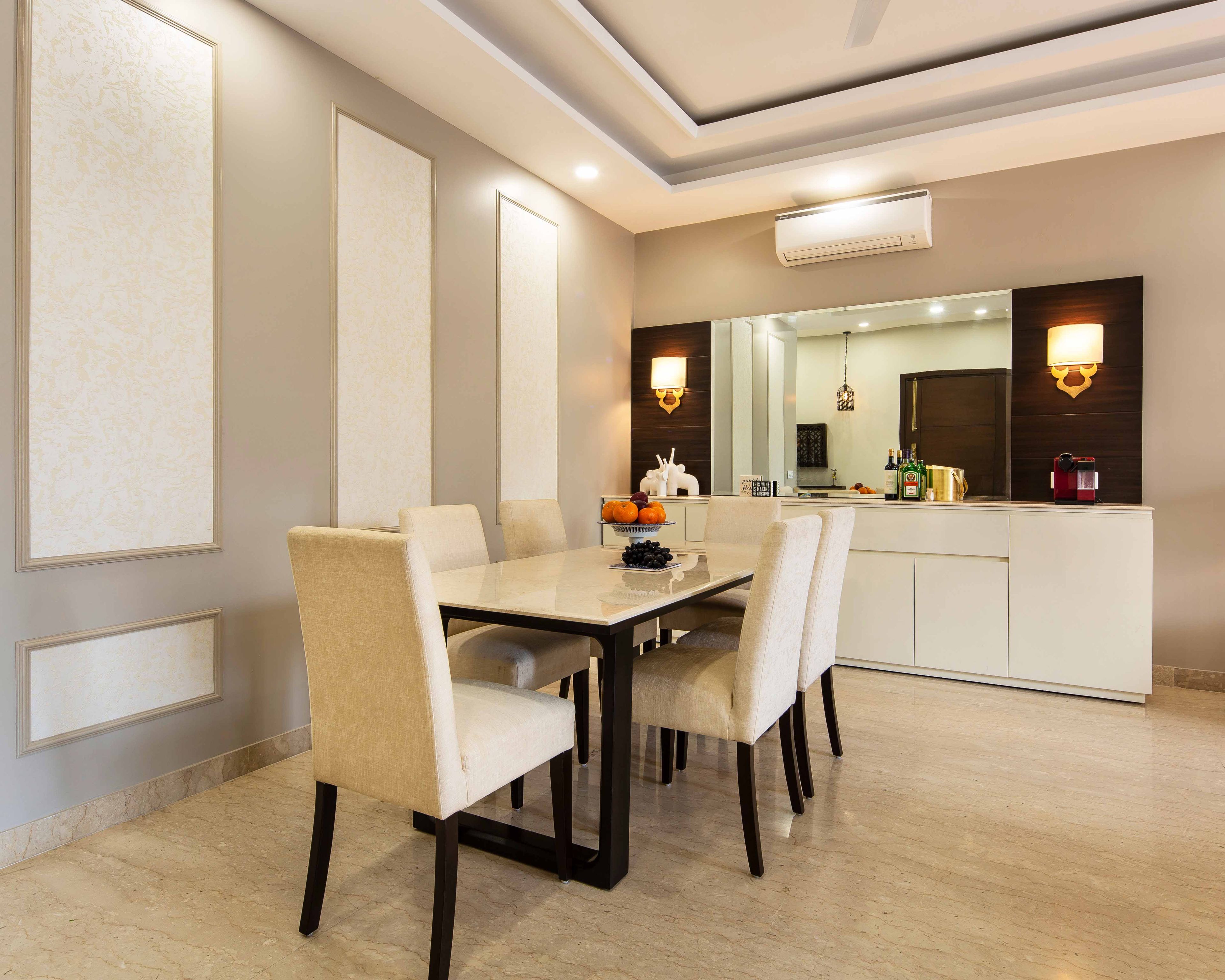 Modern 6-Seater Dining Room Design With Cream And White Accent Wall And Trims