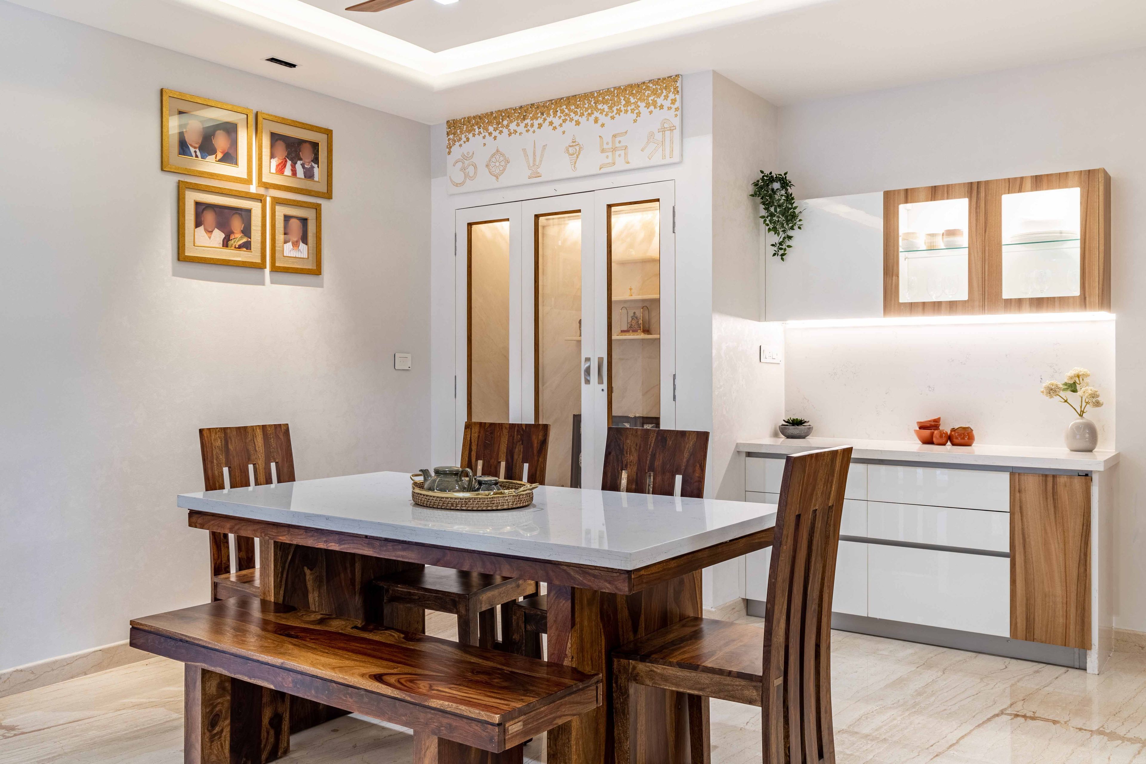 Modern 4-Seater Dining Room Design With Closed Mandir Unit And White-Wood Storage Unit