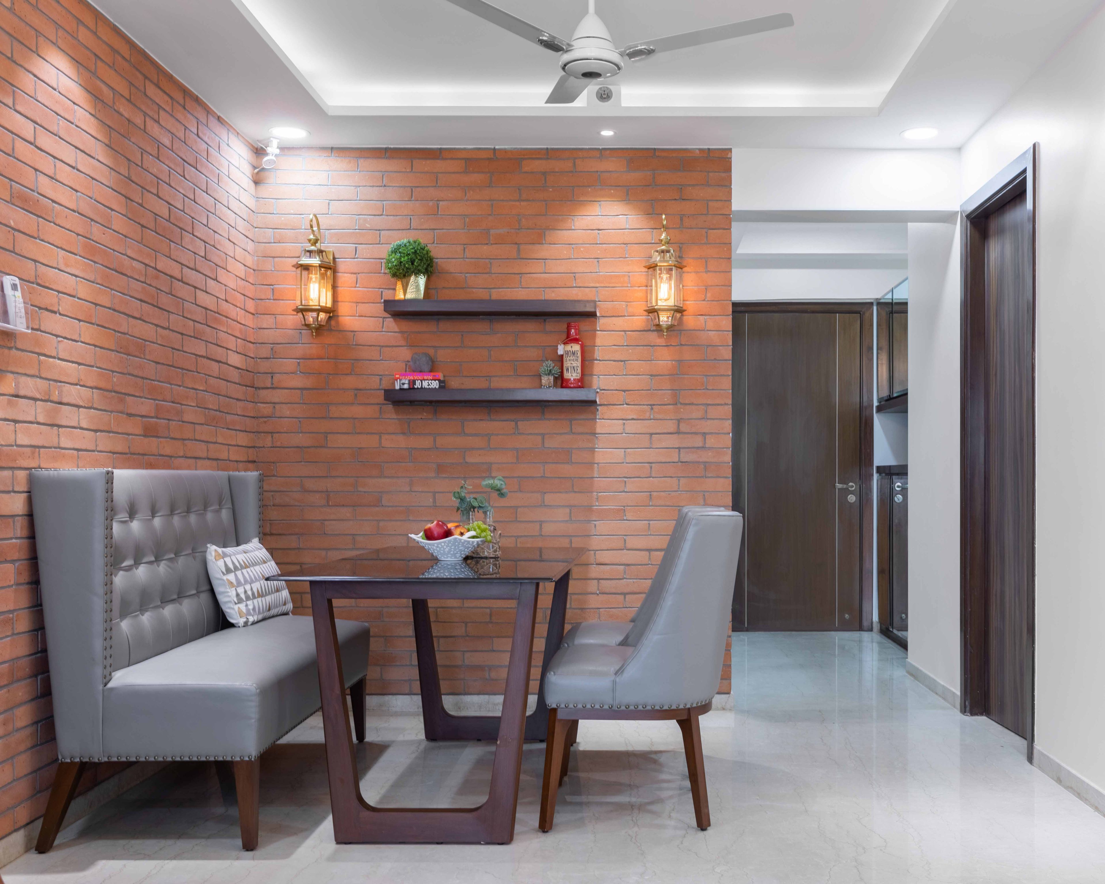Classic 2-Seater Wood And Grey Dining Room Design With Red Brick Accent Wall