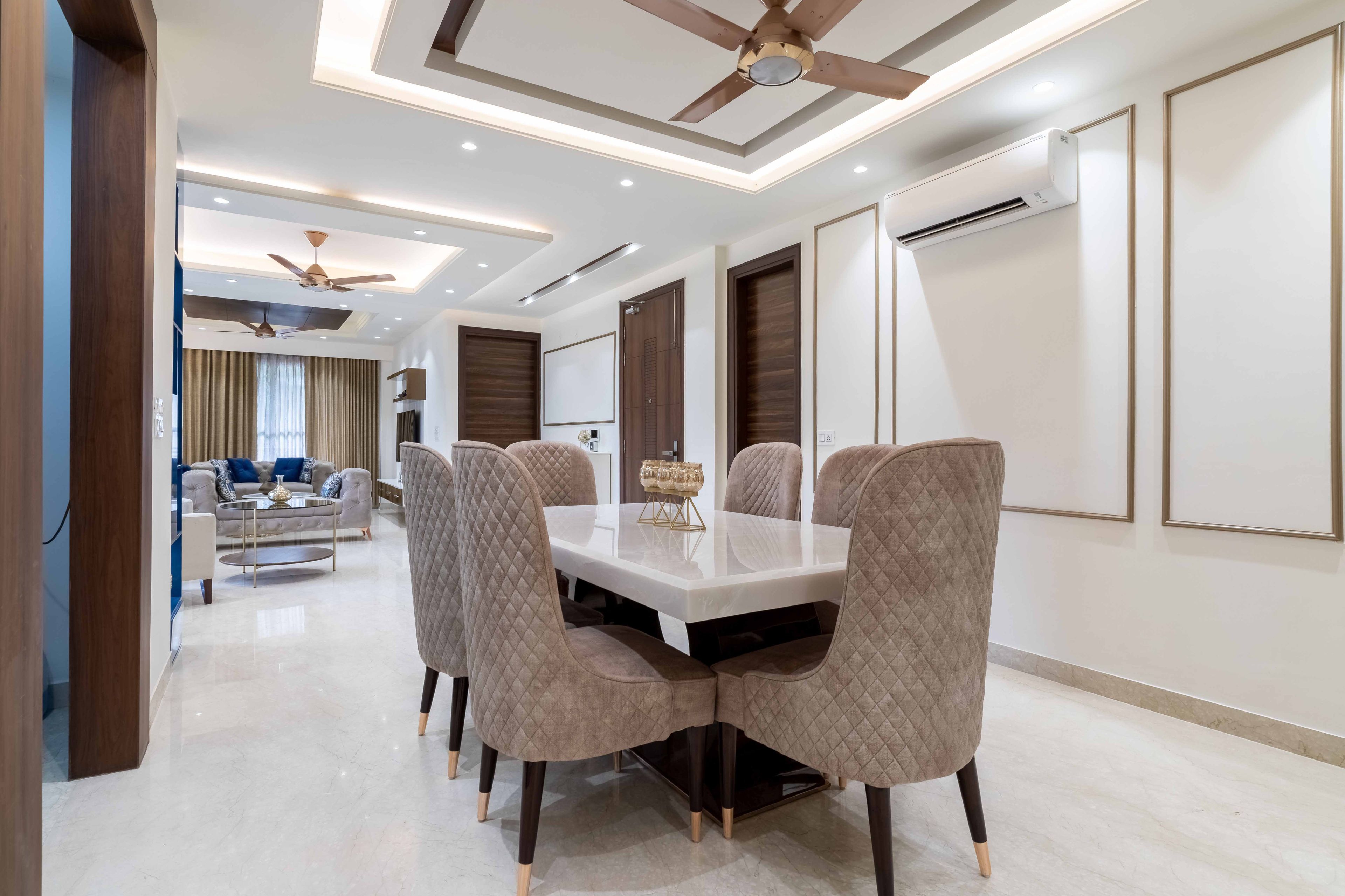 Contemporary 6-Seater White And Beige Dining Room Design With Tufted Chairs