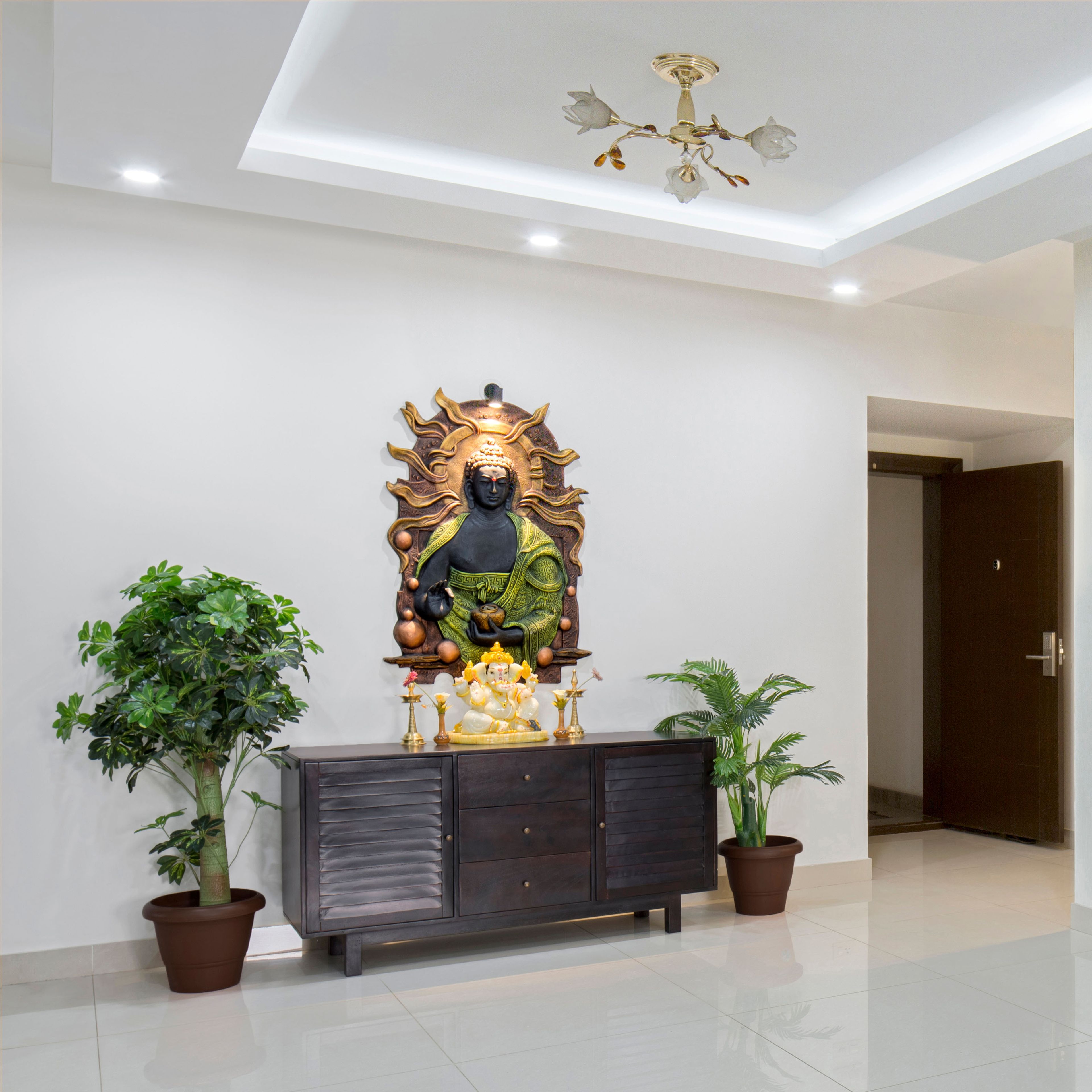 Classic Foyer Design With Gold Wall Art