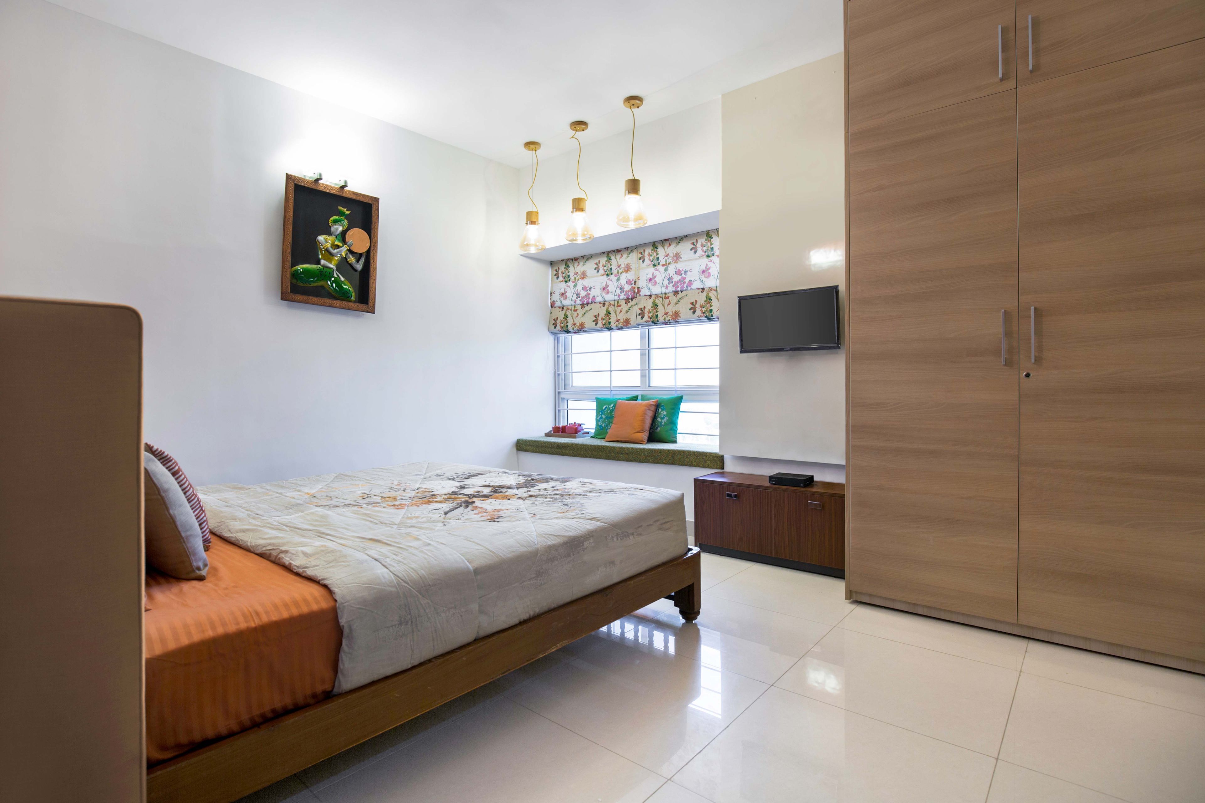 Guest Room Design With Multicoloured Accent Wall And 3D White Wall - Livspace