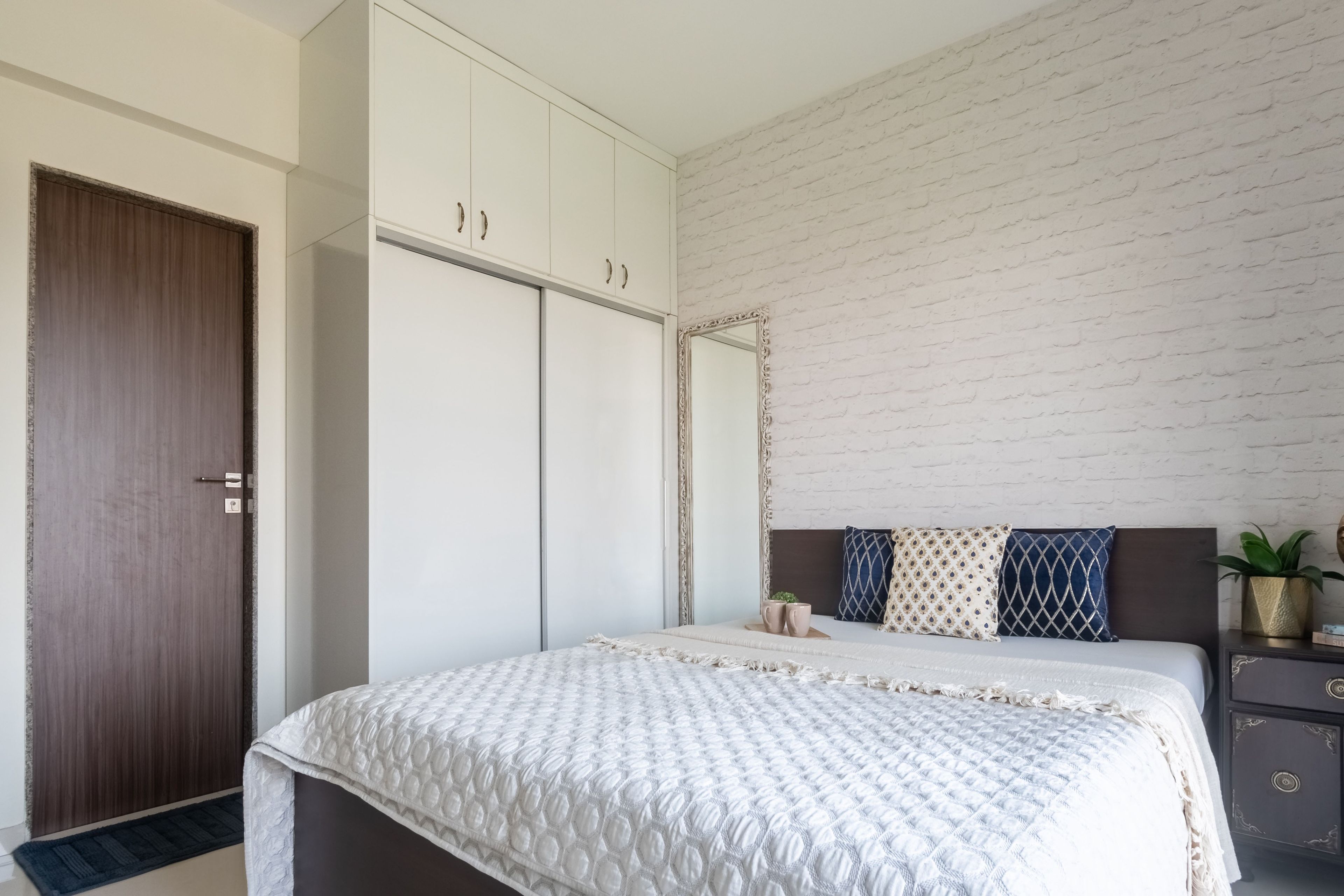 Eclectic Guest Room Design With White Brick Accent Wall