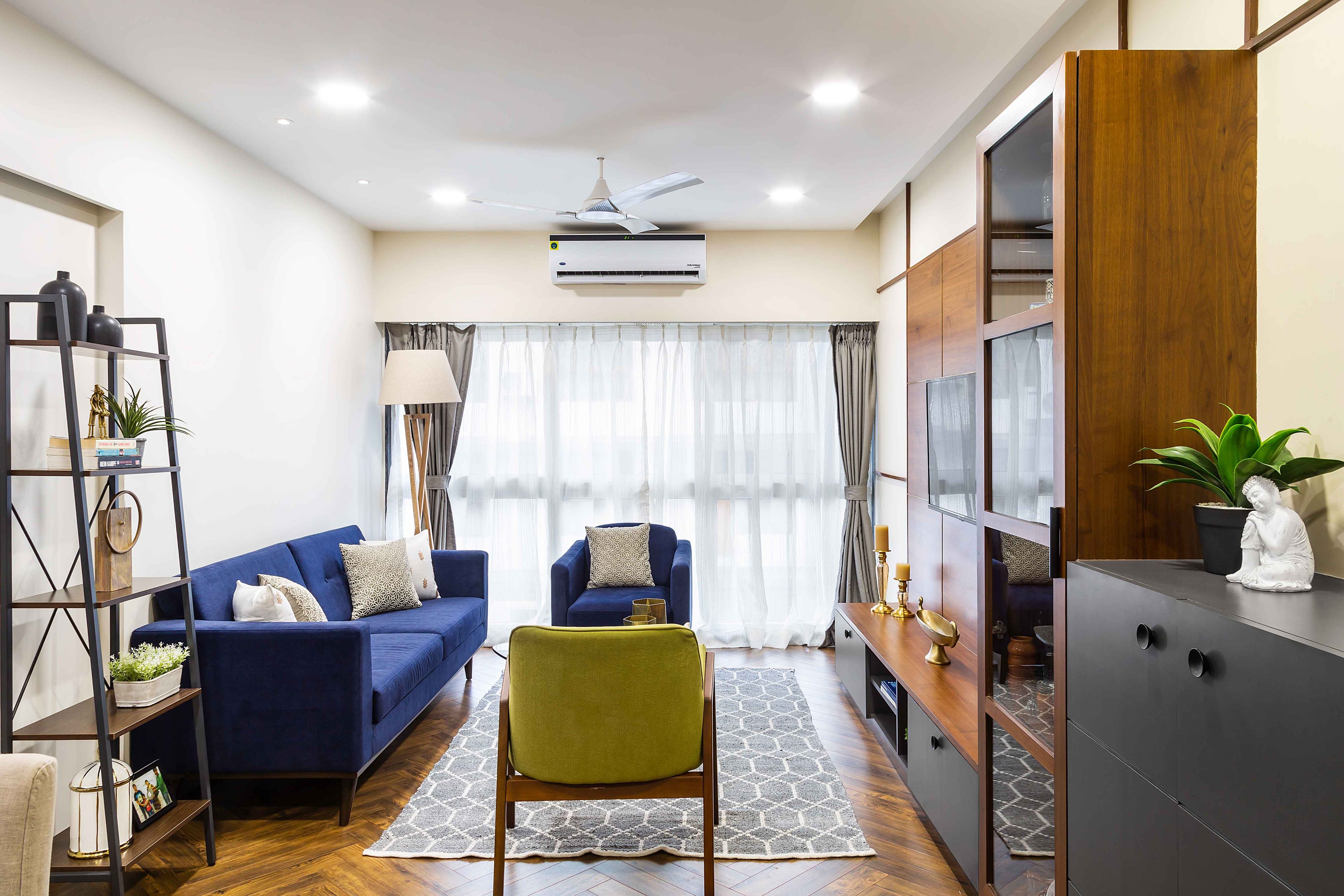 Dark blue and mustard yellow living room design - Livspace