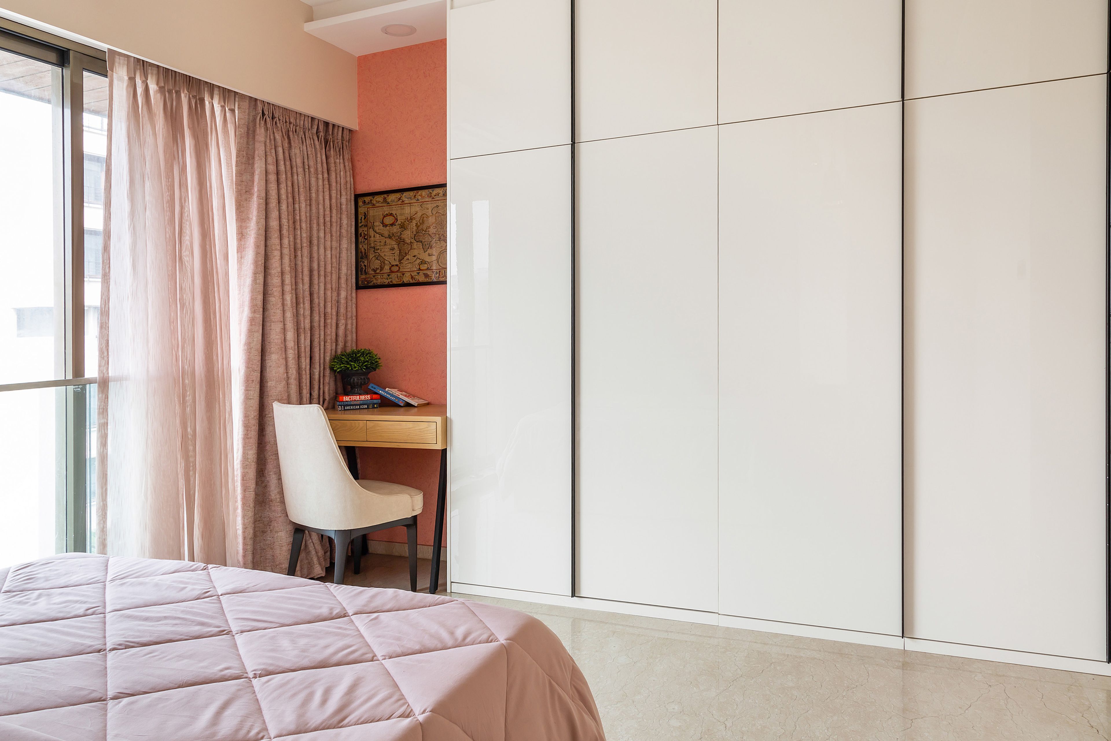4-door white sliding wardrobe with lofts for master bedroom - Livspace