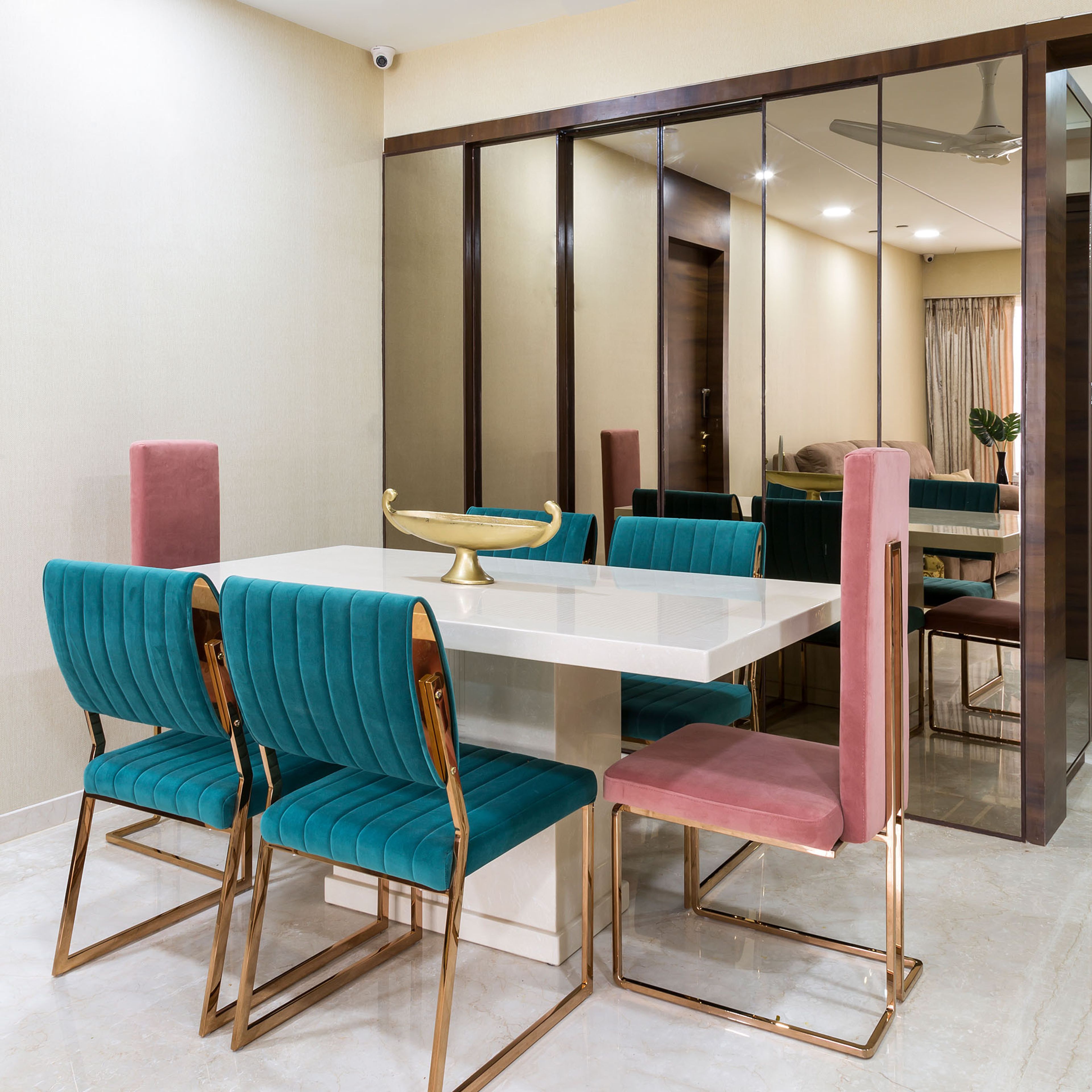 6-seater teal blue and pink dining table with quartz countertop - Livspace