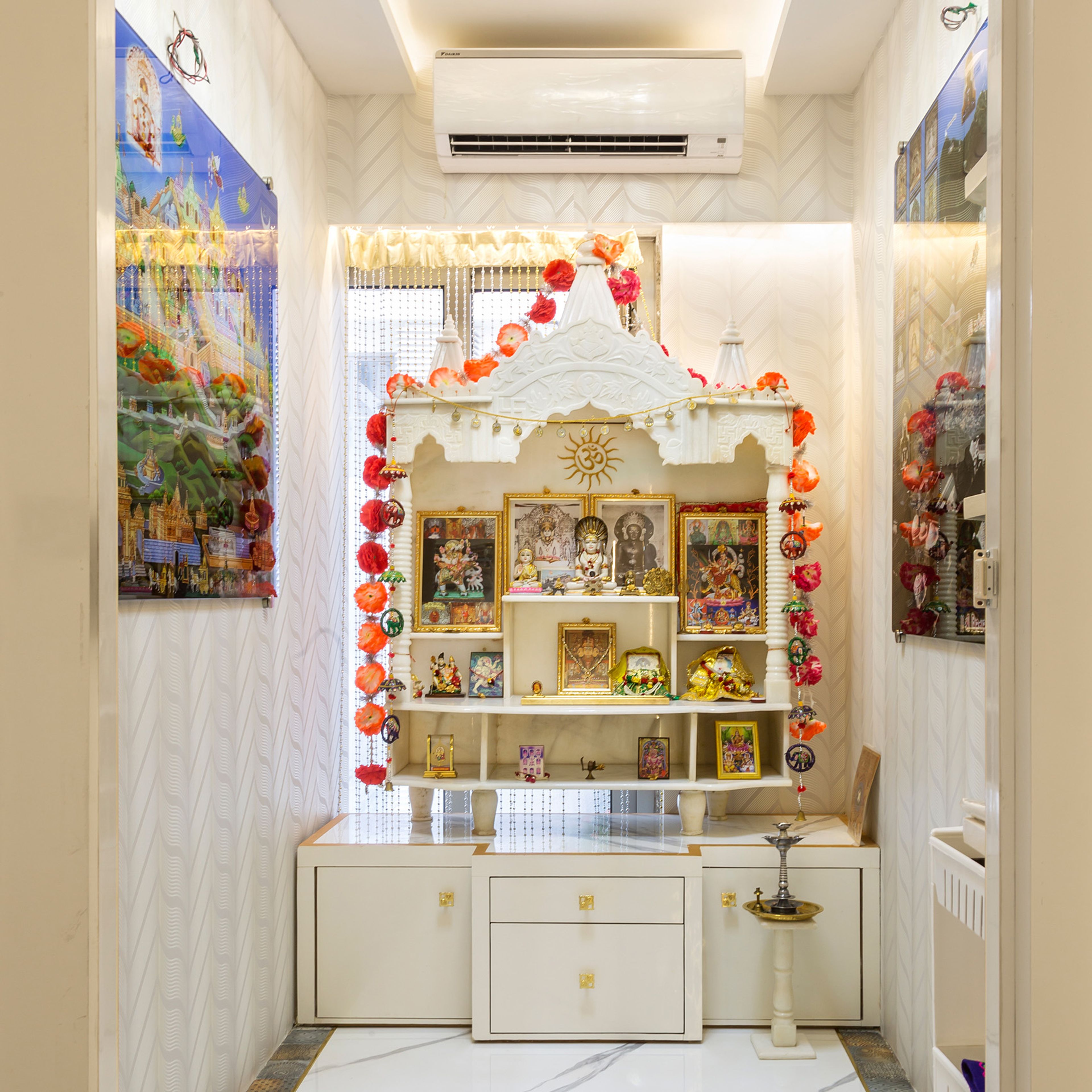White mandir unit design with floor-mounted storage - Livspace