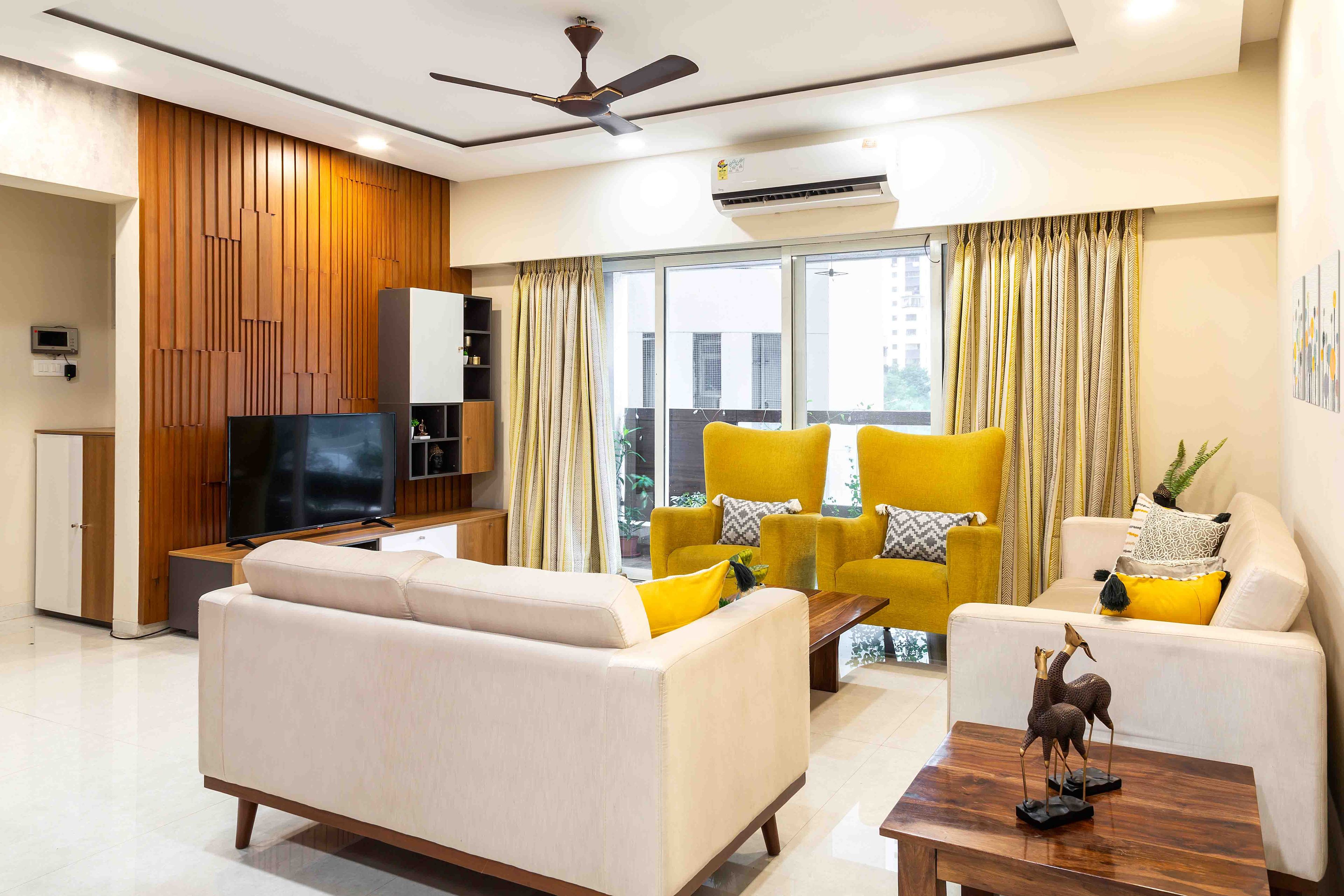 Contemporary 4 BHK Flat In Mumbai With Wooden Panelling In The Living Room