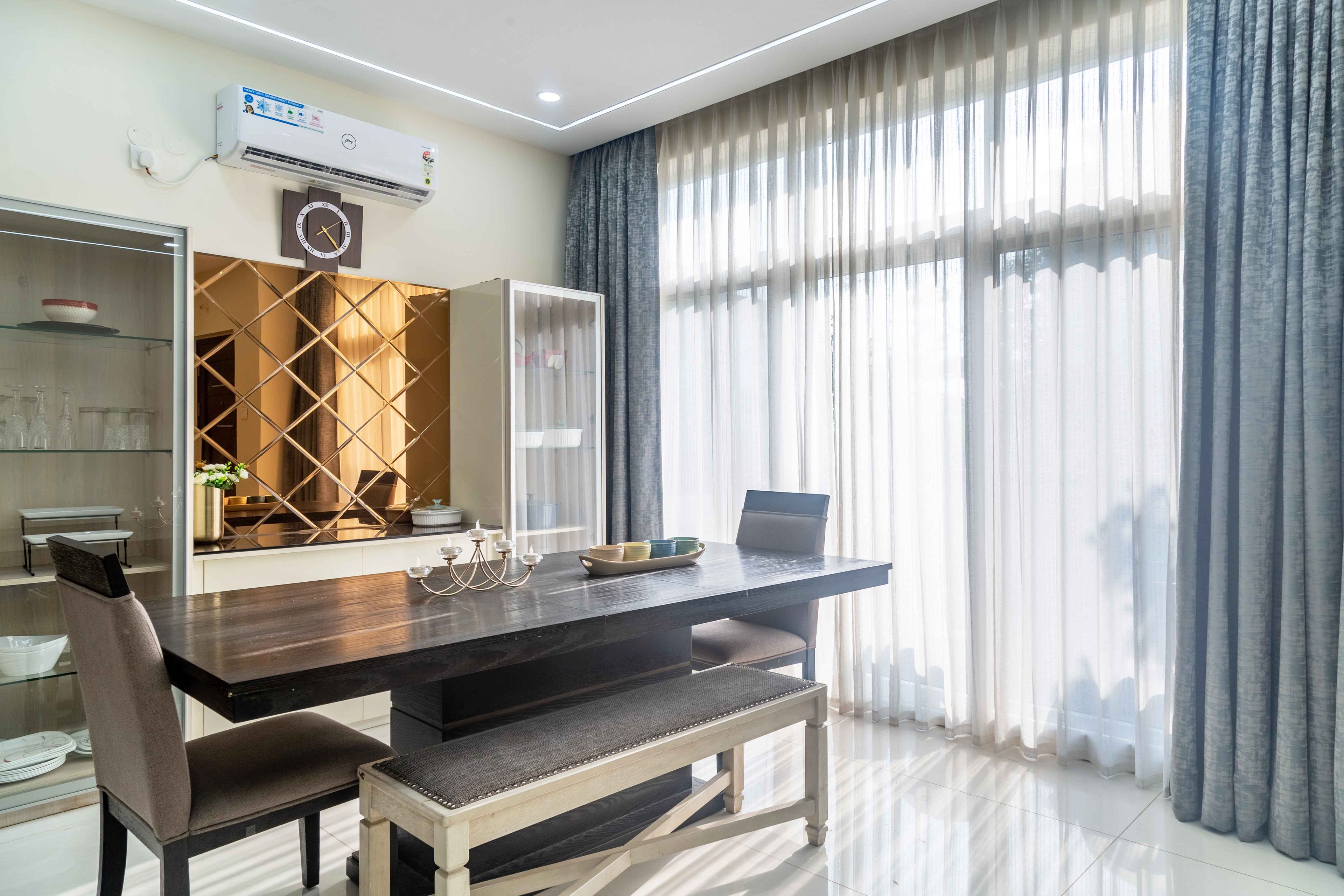 2-seater wooden dining table with crockery unit - Livspace