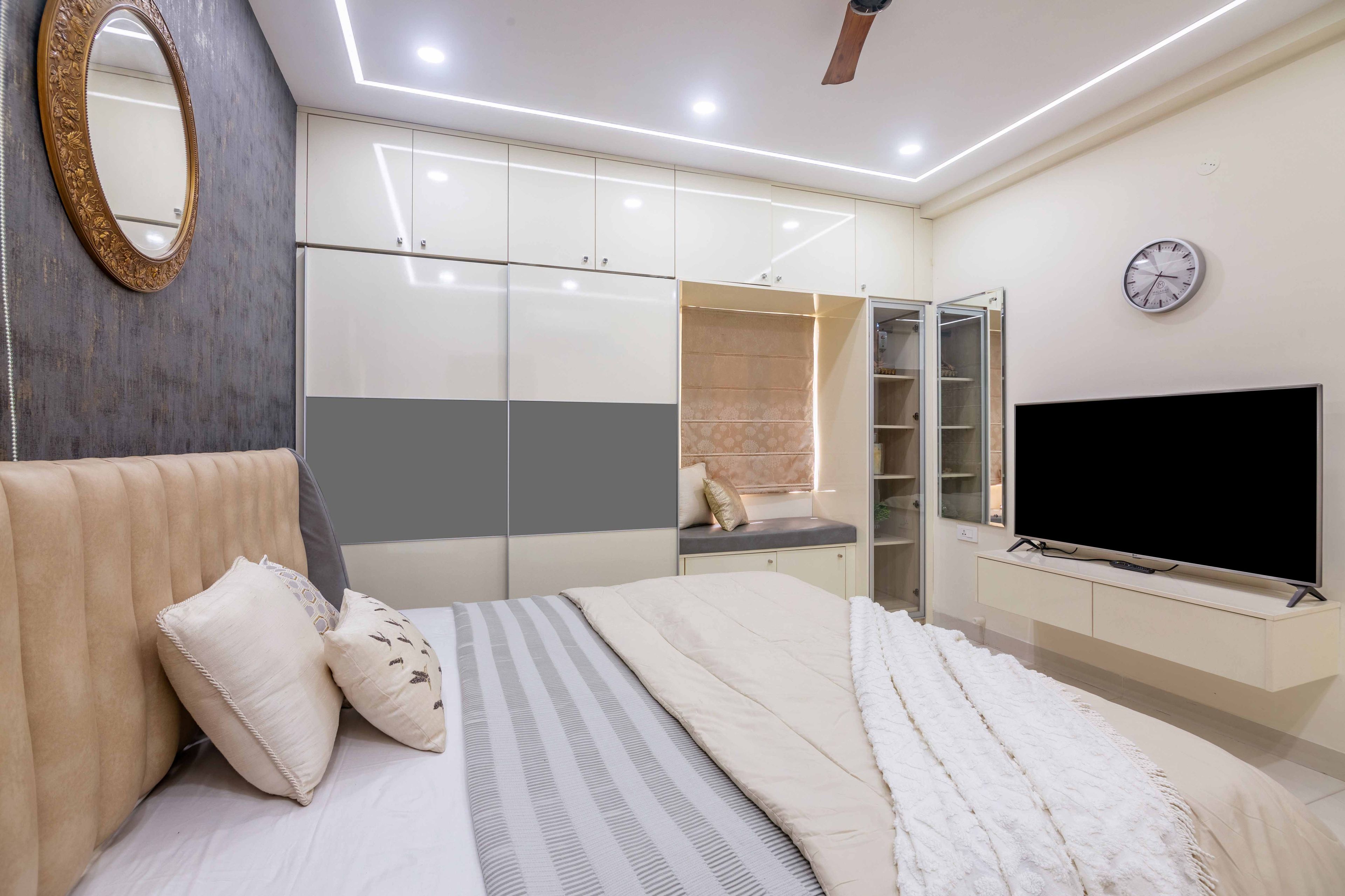 Off-white and grey sliding wardrobe with loft storage - Livspace