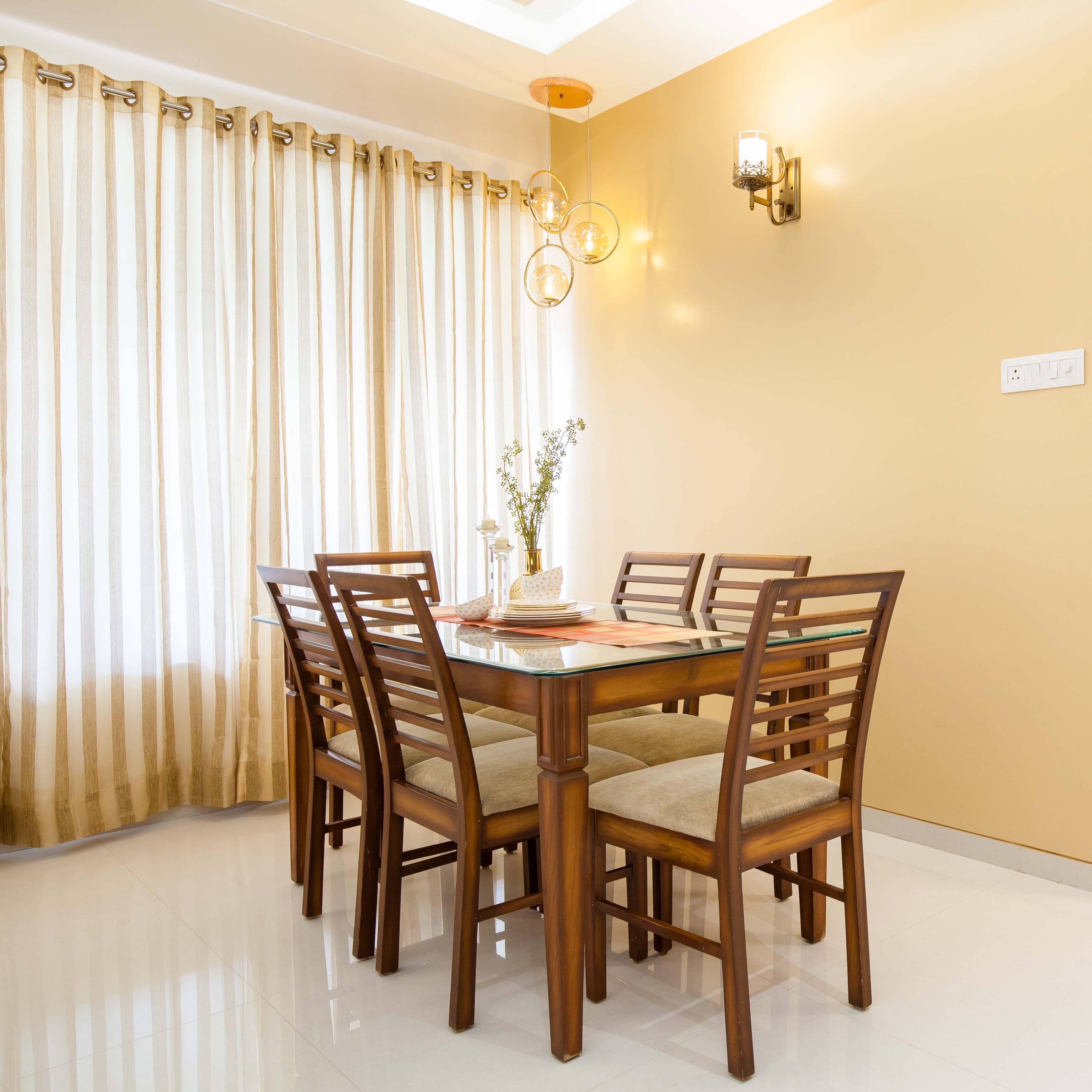 6-seater wood and glass dining room design - Livspace