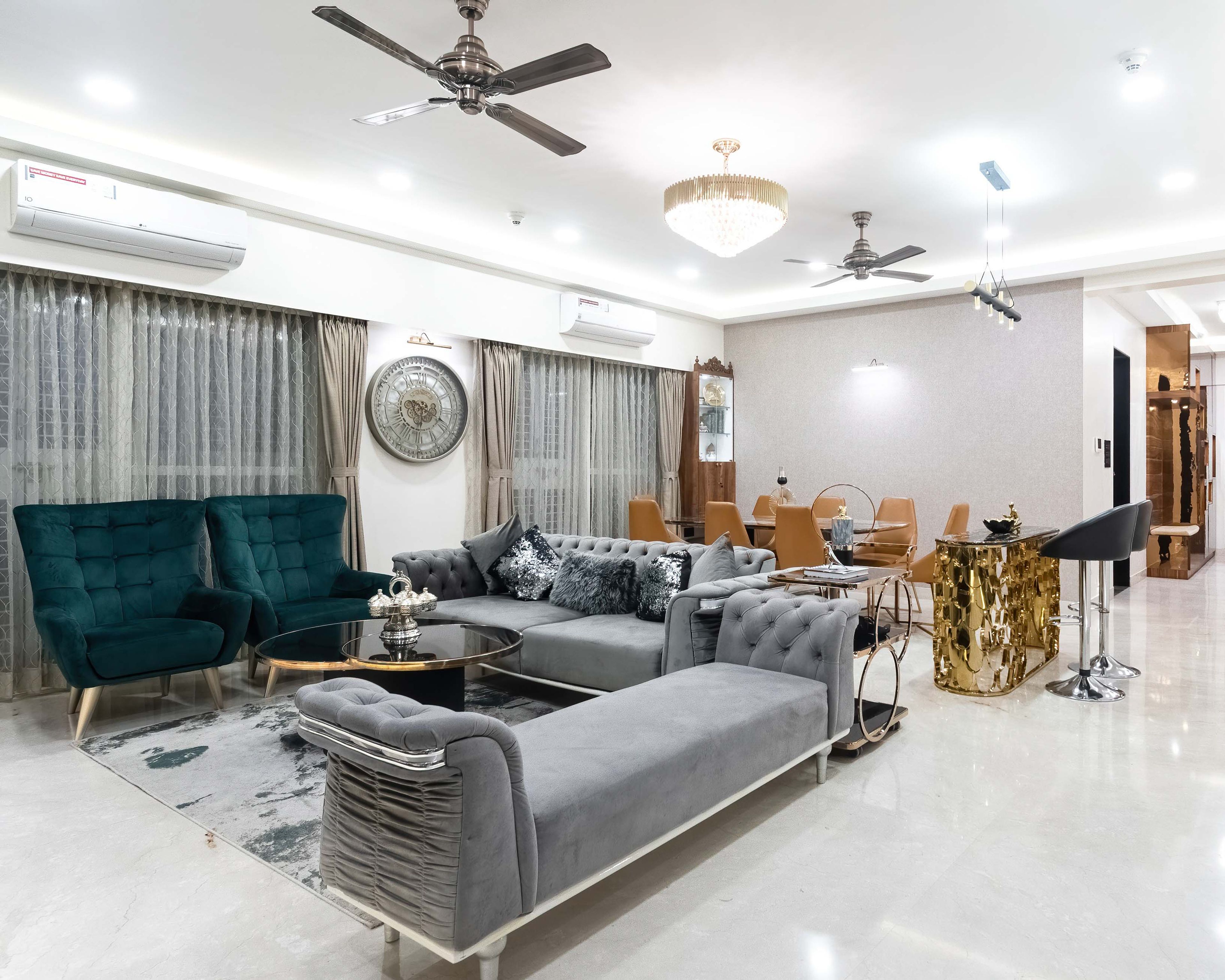 Grey and teal blue living room integrated with 7-seater dining table - Livspace