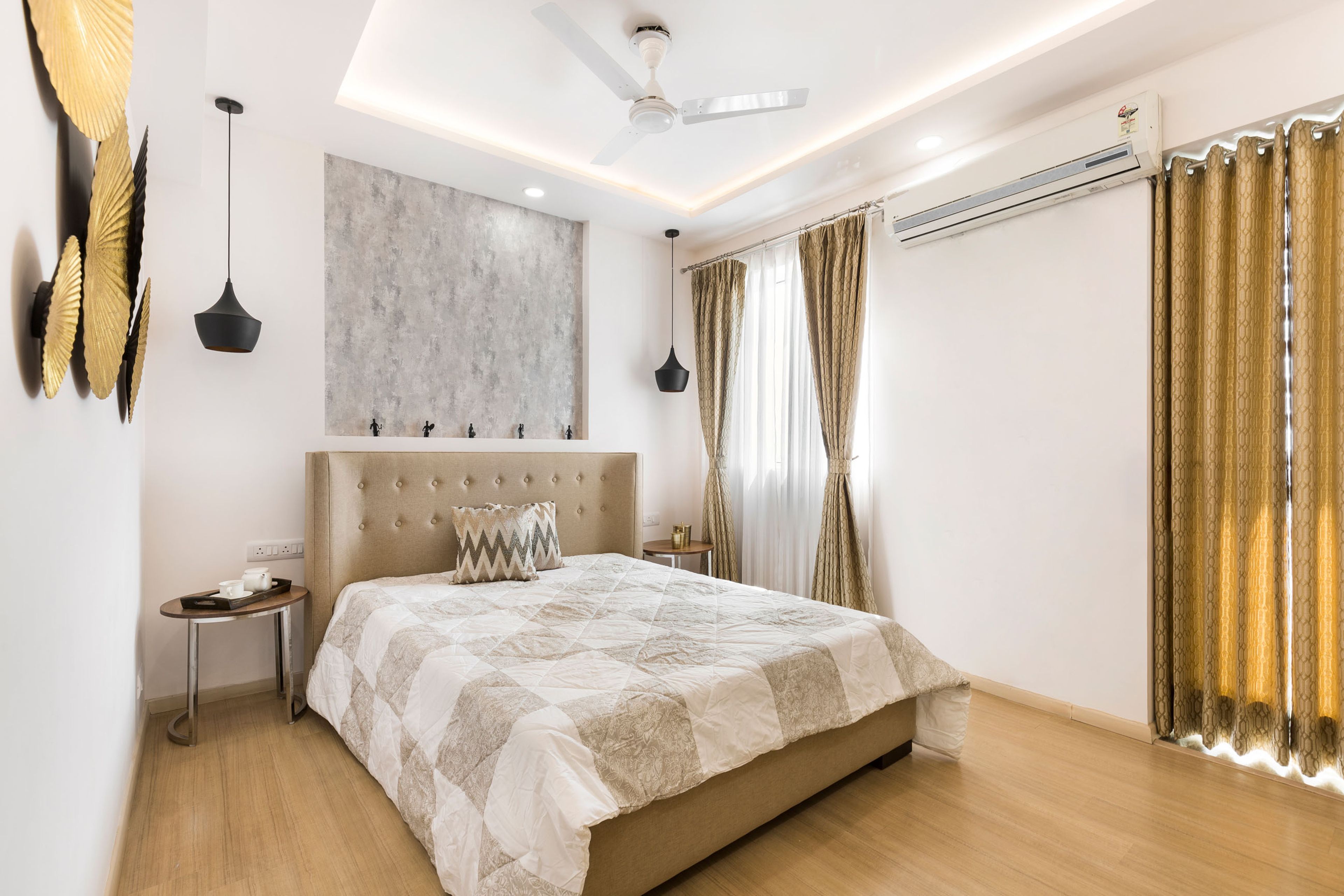 Guest room with beige headboard - Livspace