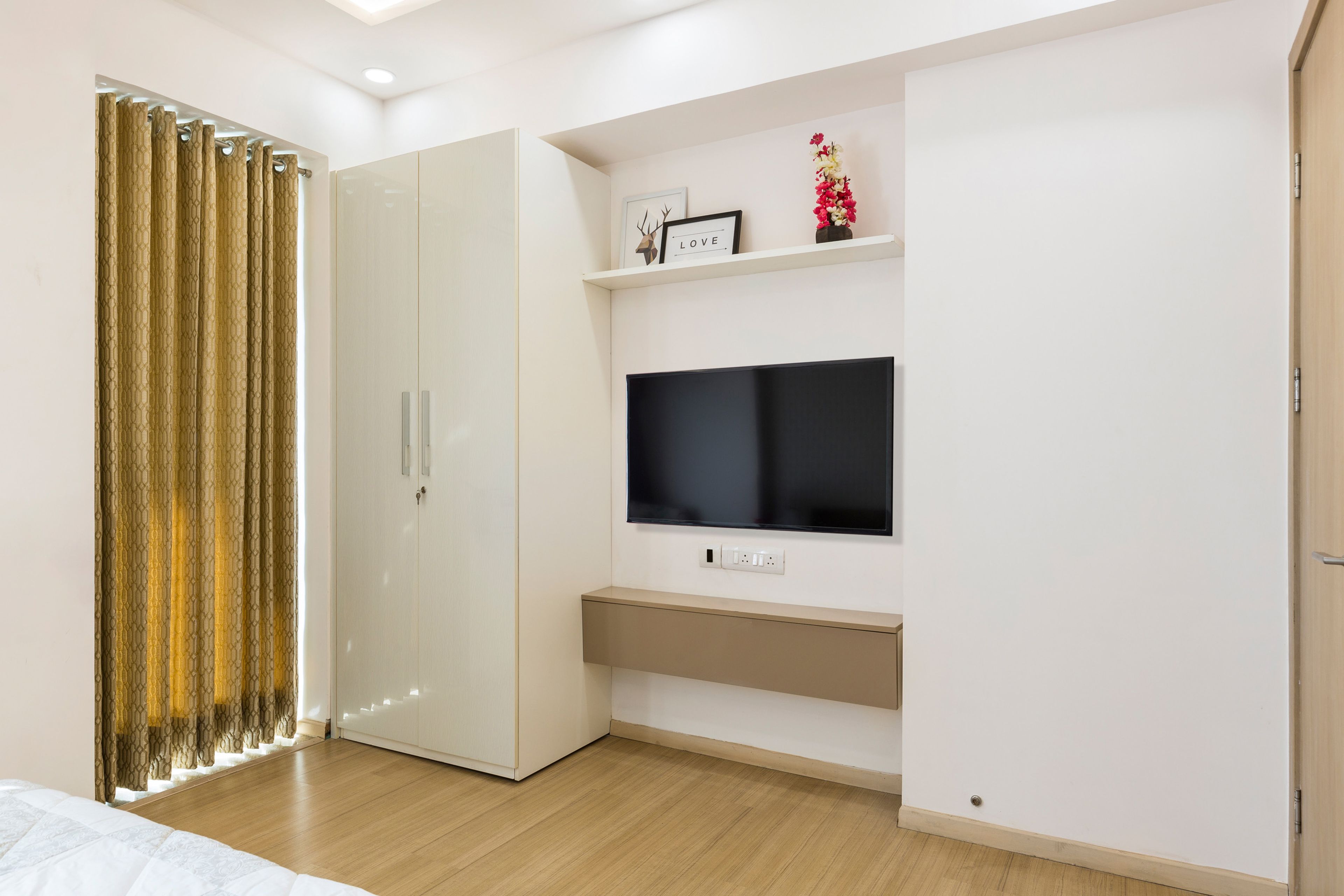 Guest room with 2-door off-white swing wardrobe - Livspace