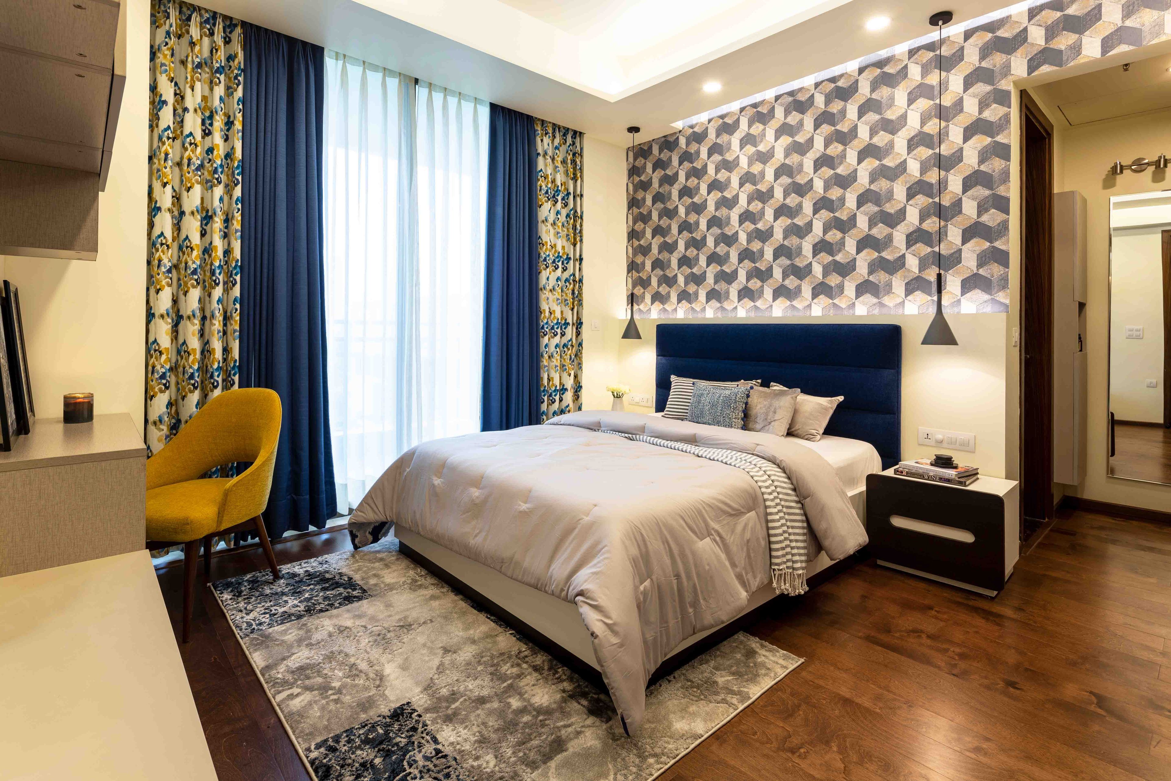 Kids room with queen sized bed and dark blue headboard - Livspace