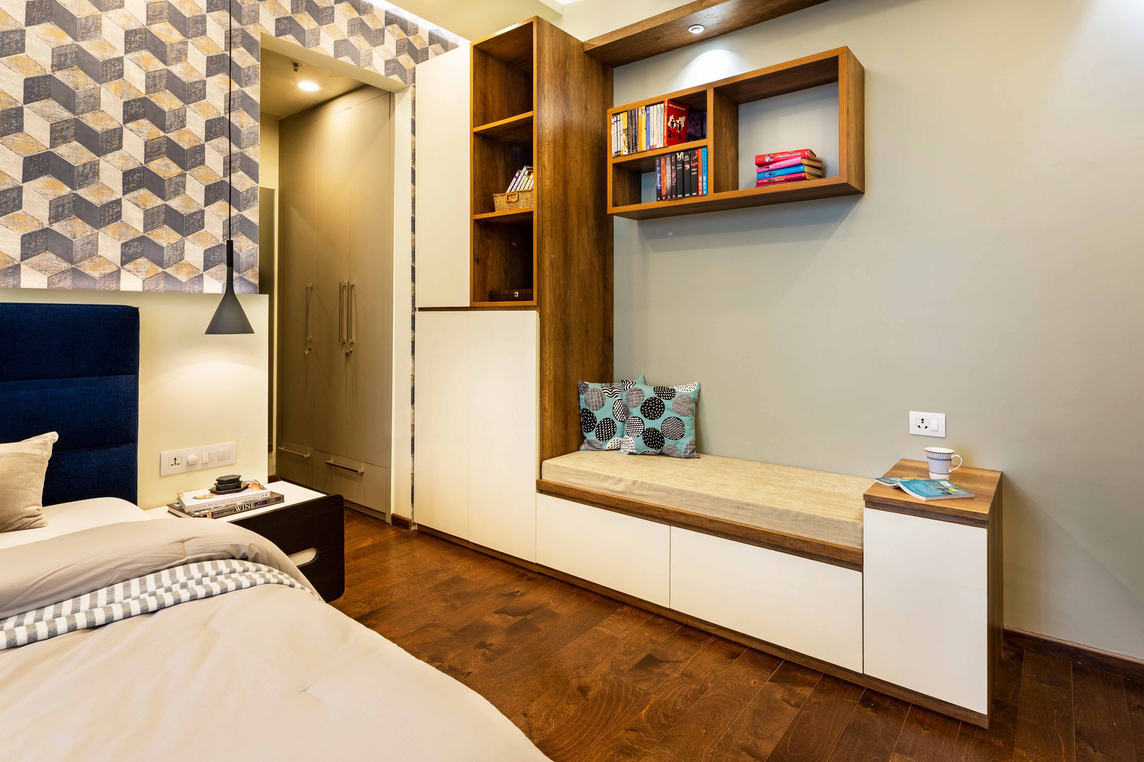 White and wood storage unit with seater and grey walk-in wardobe for kids bedroom - Livspace