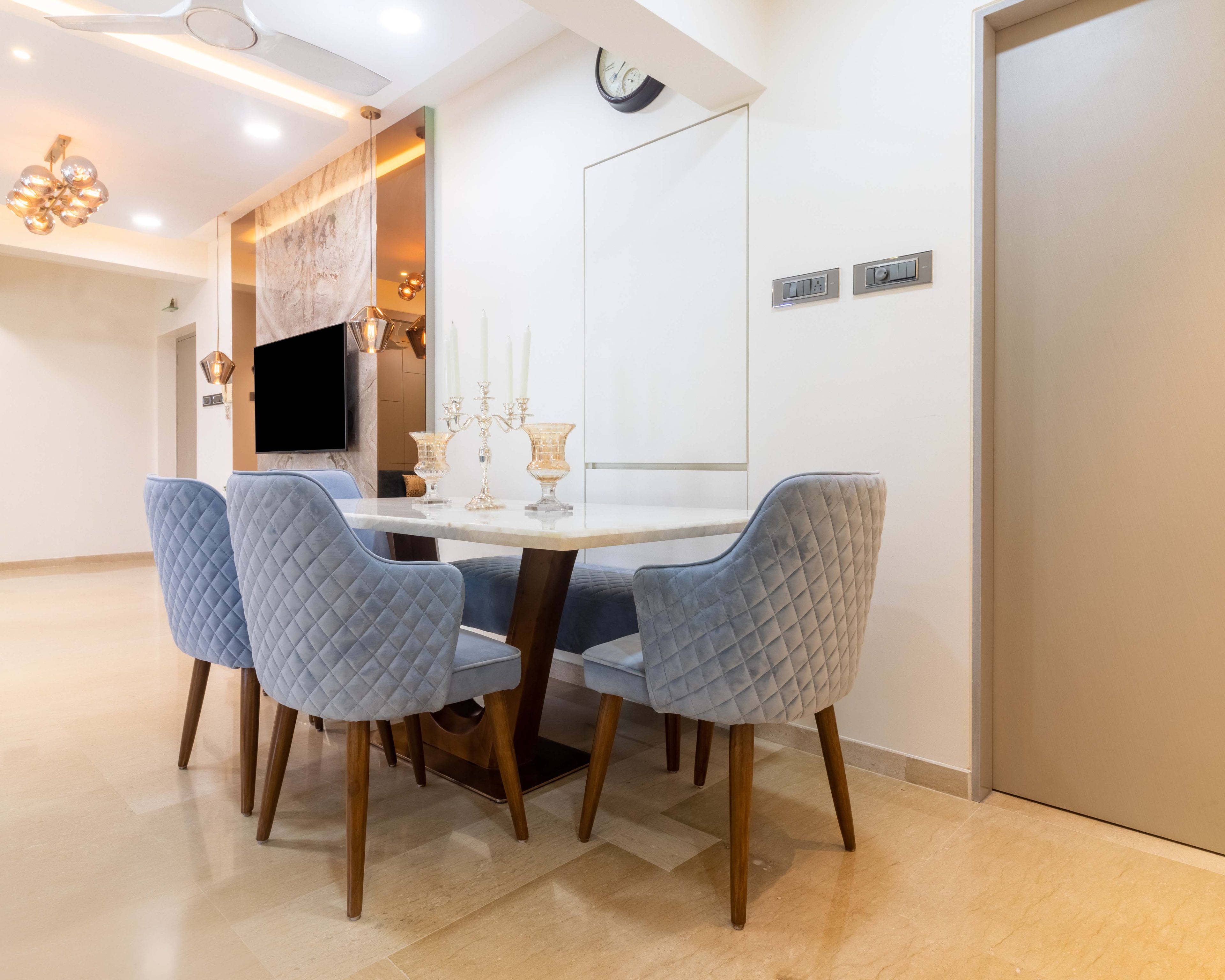 4-seater dining area with marble countertop table - Livspace