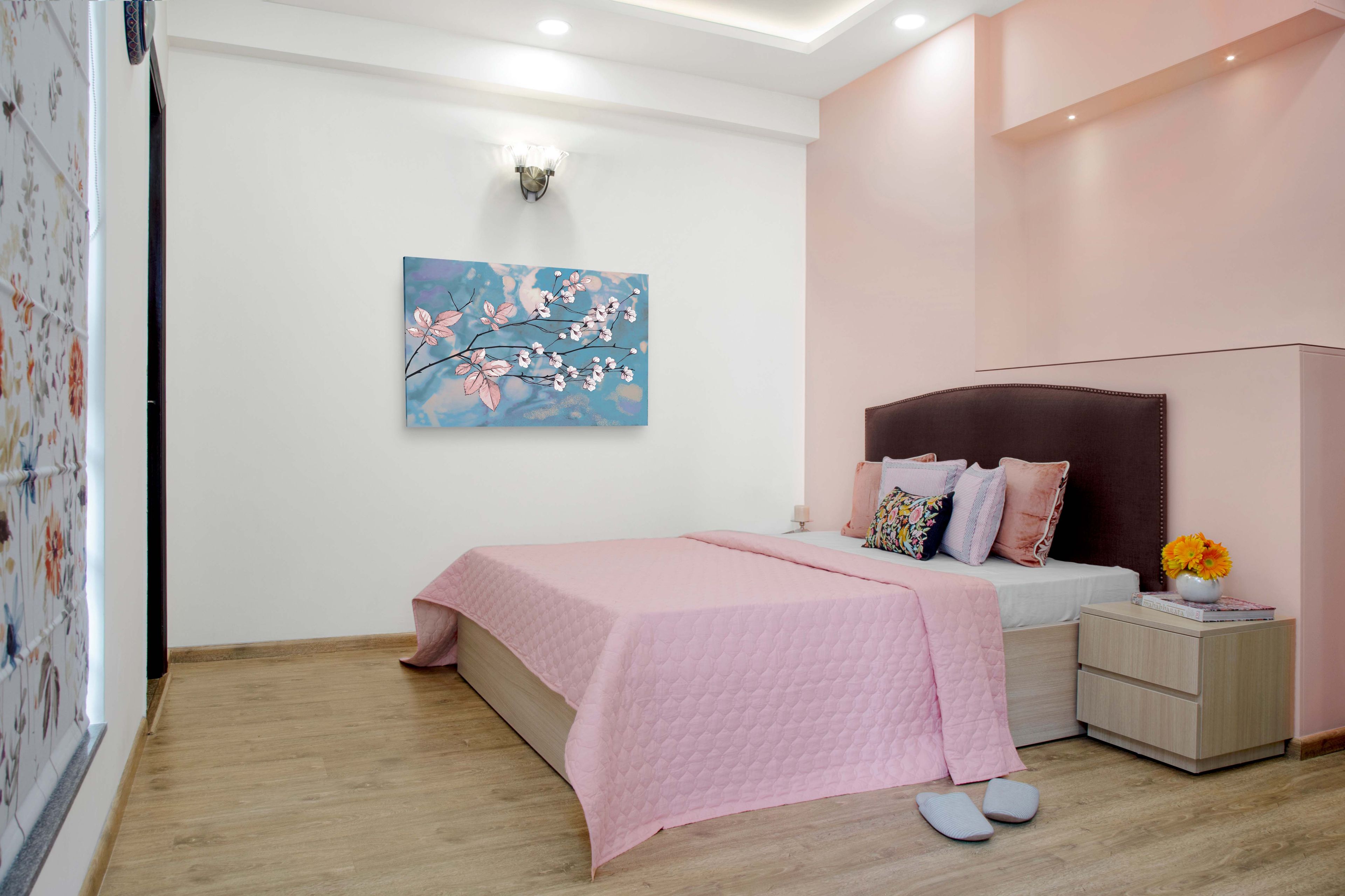 Guest room with pink accent wall - Livspace
