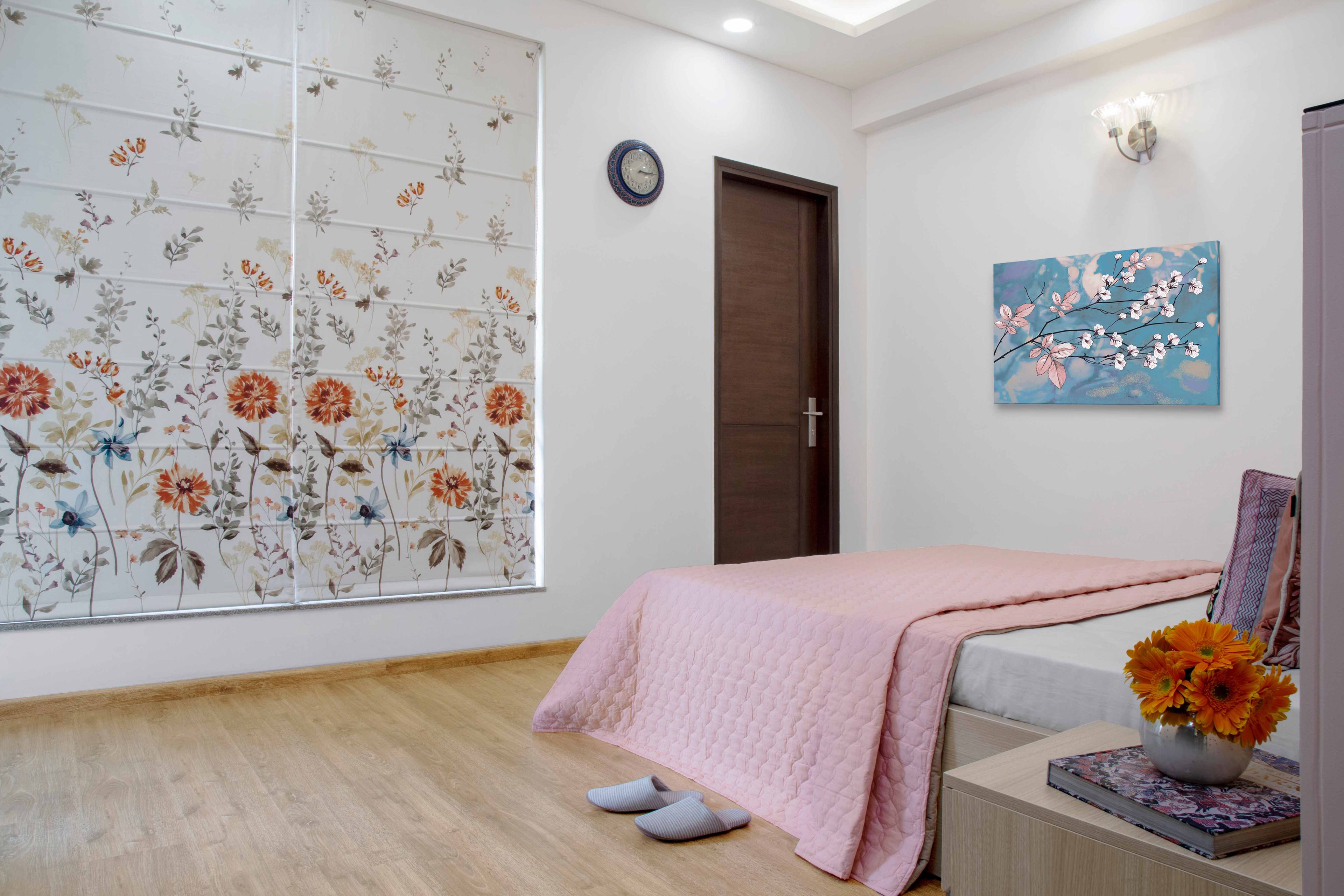 Guest room with wooden flooring - Livspace