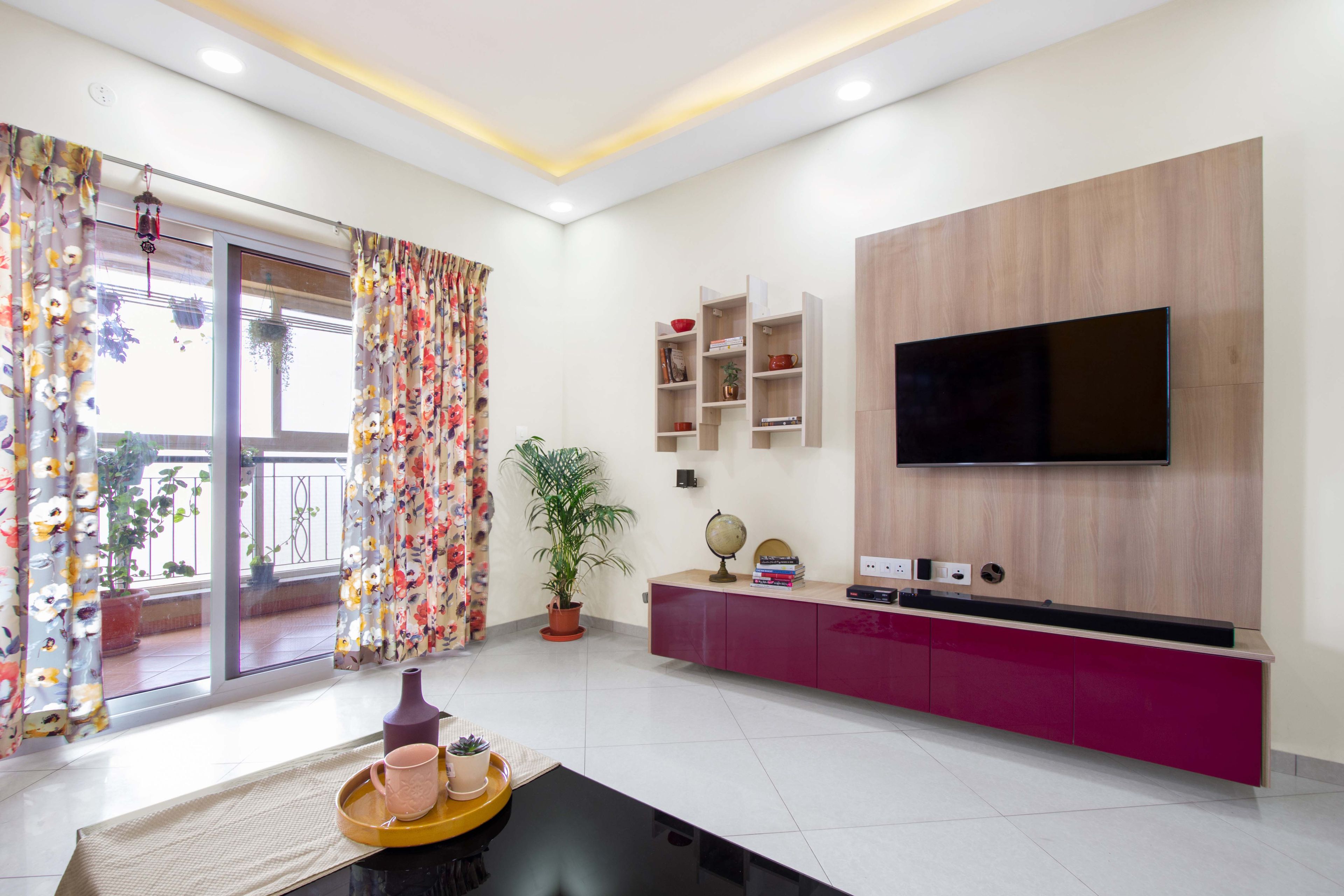 Burgandy and wood TV unit design - Livspace