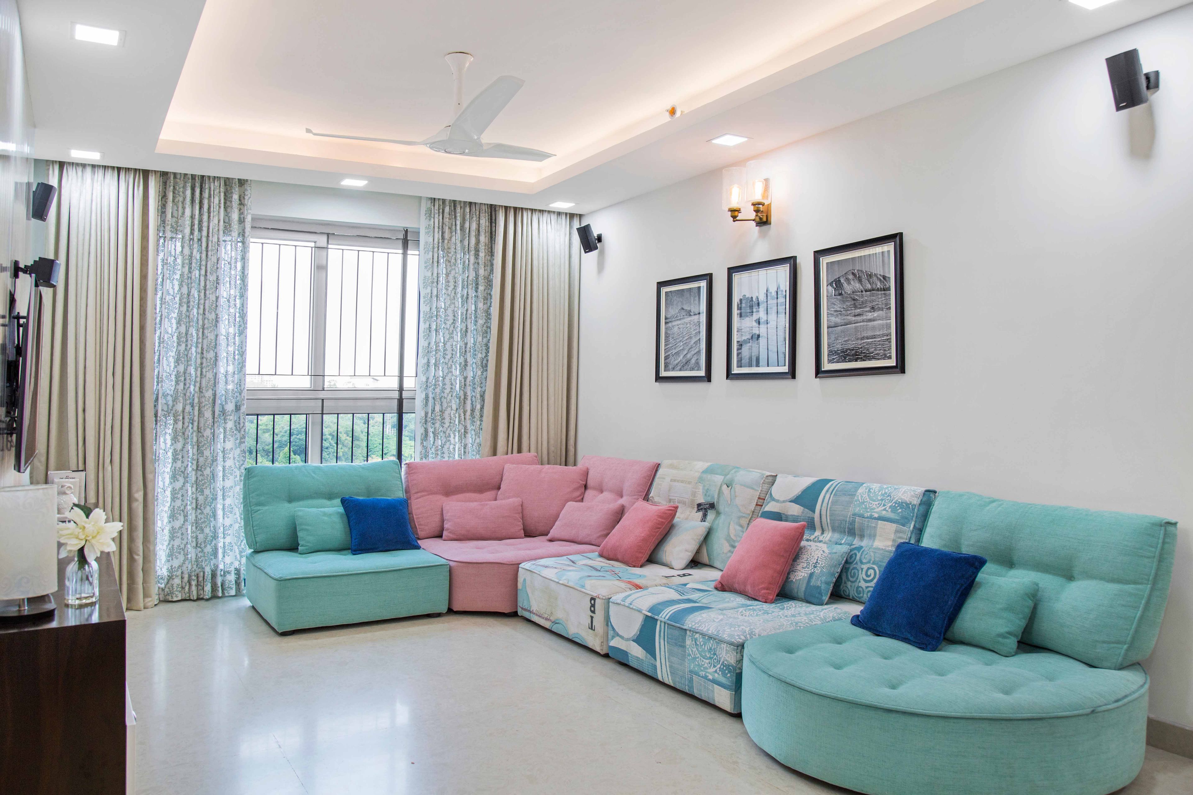 Mint green and baby pink L shaped living room sectional sofa - Livspace