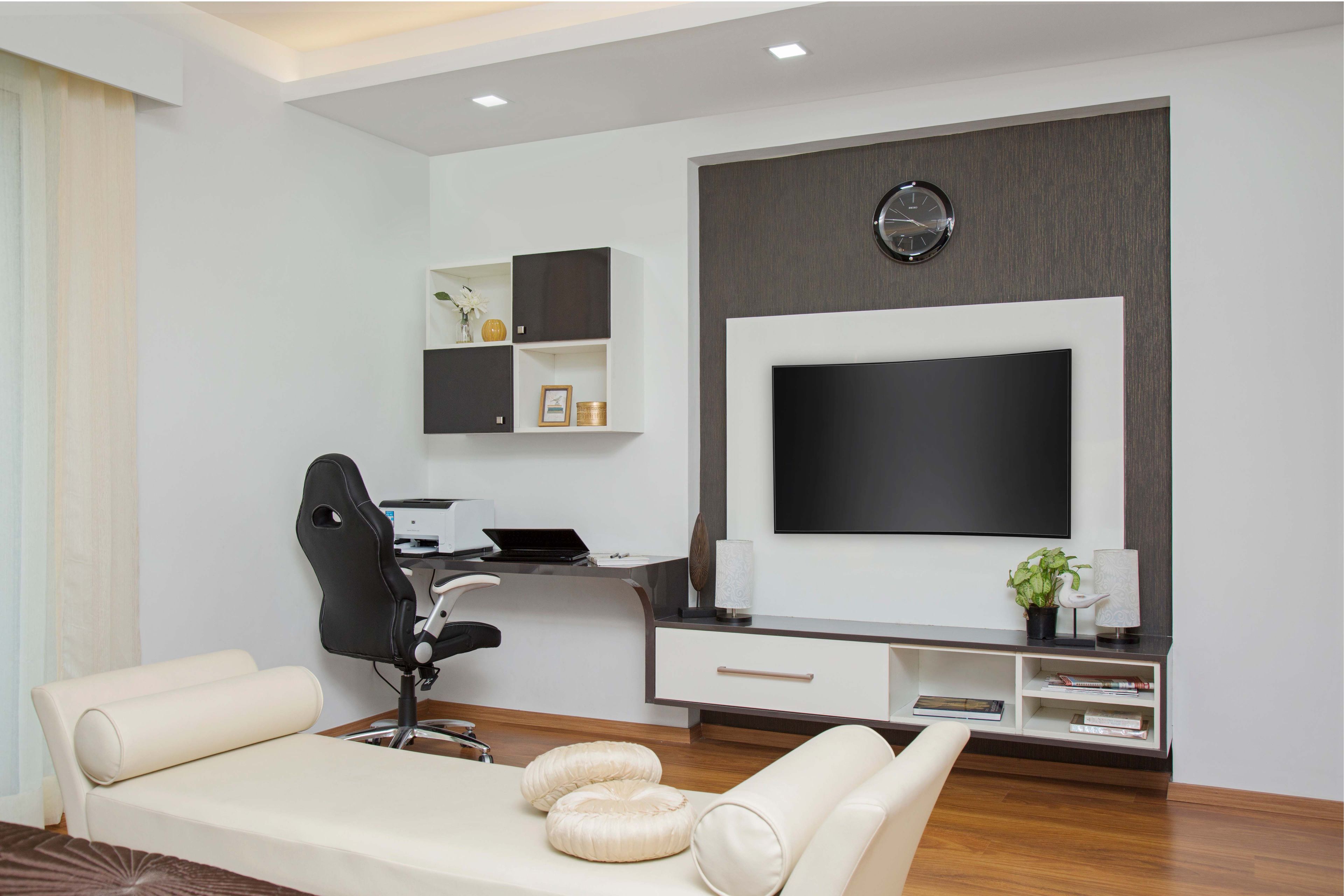 Compact white and wood TV unit integrated with study table - Livspace