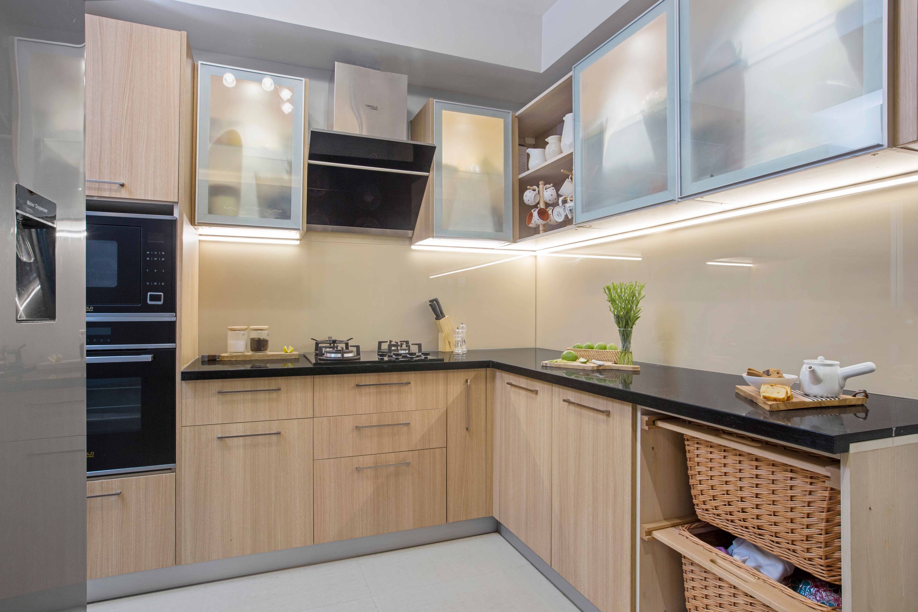 Wooden L shaped kitchen design with frosted glass shutters - Livspace