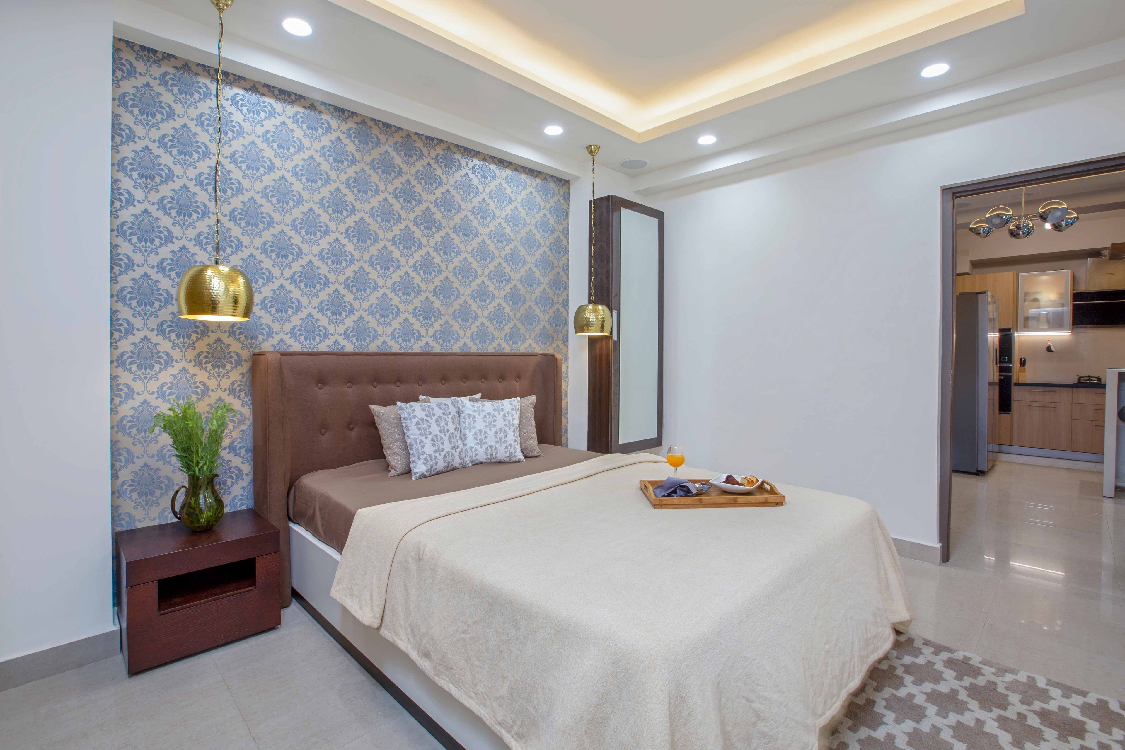 Contemporary 2-BHK Apartment Design In Noida With Blue-Themed Living Room