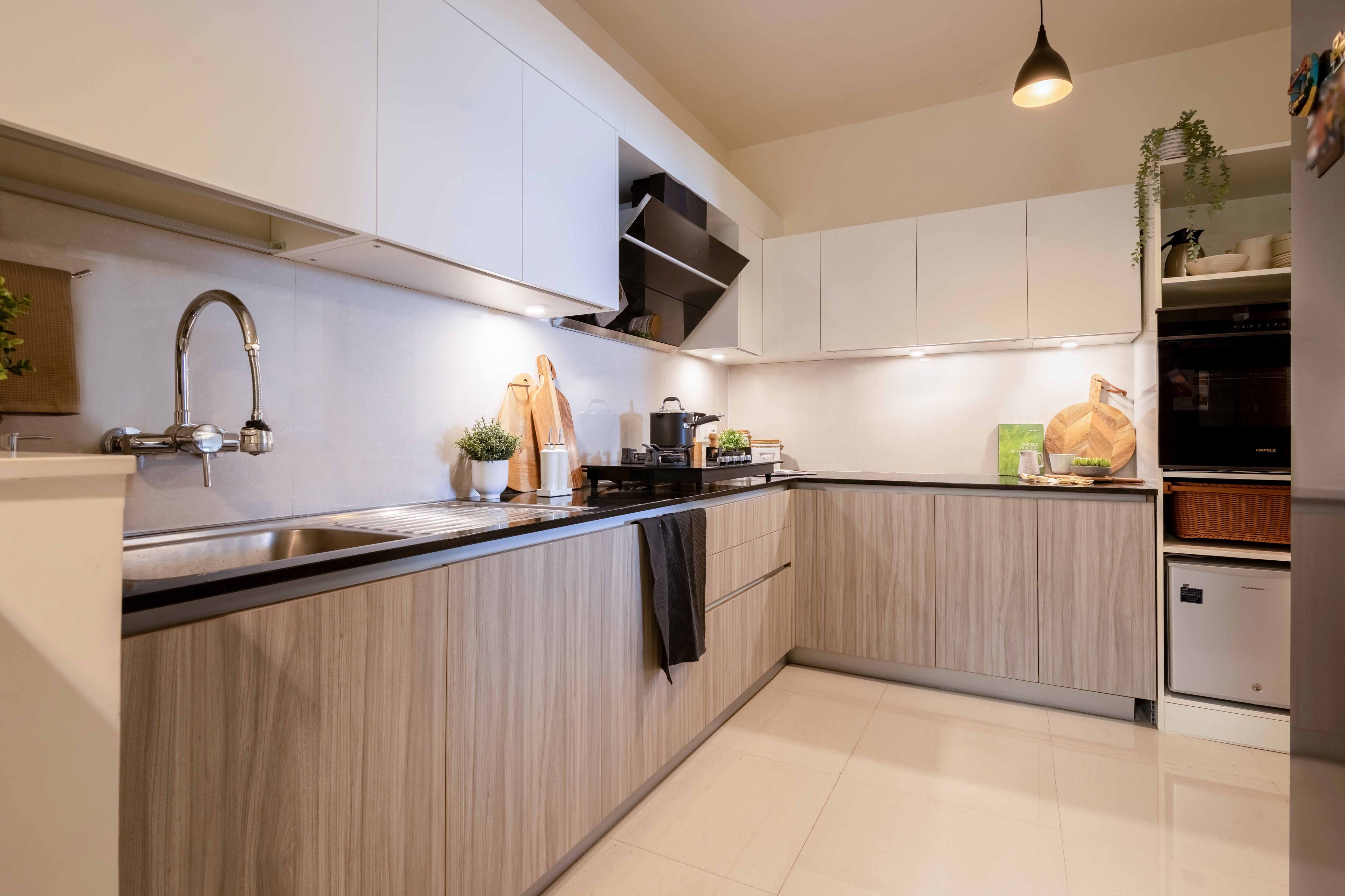 L-shaped white and wood kitchen - Livspace
