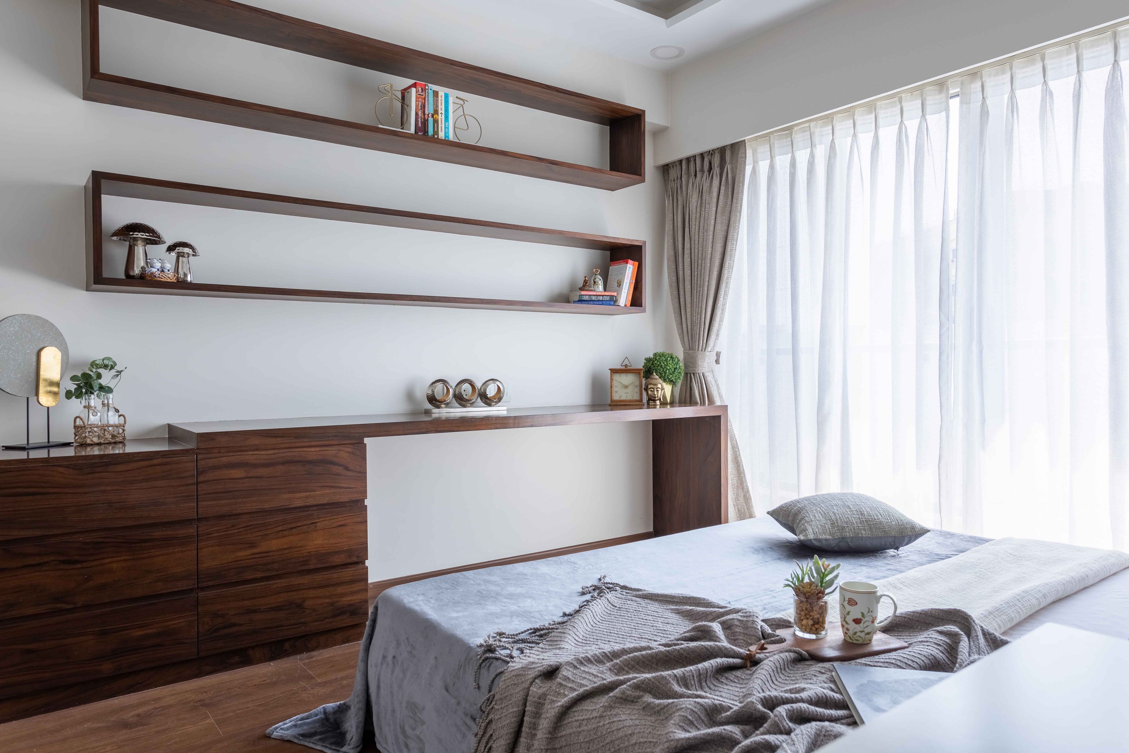 Wooden wall shelves and a dashboard with cabinets - Livspace