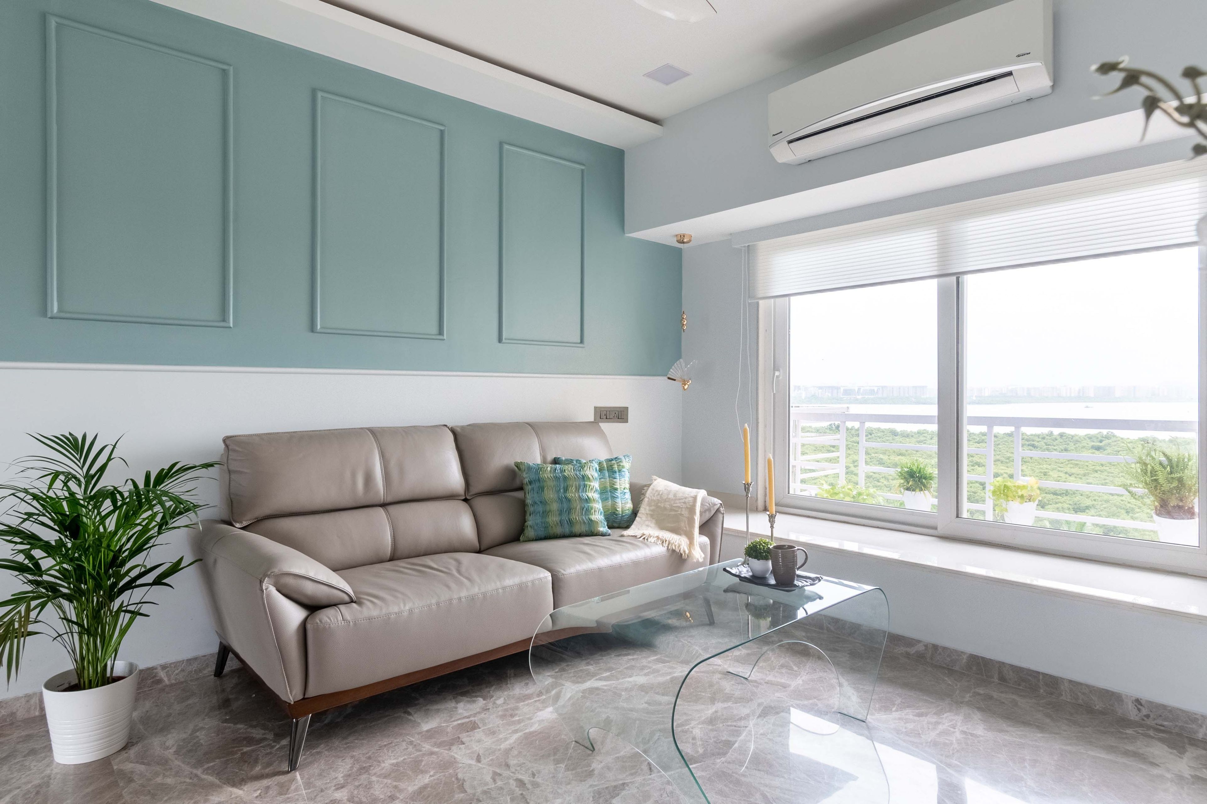 Blue panelled wall with beige sofa - Livspace