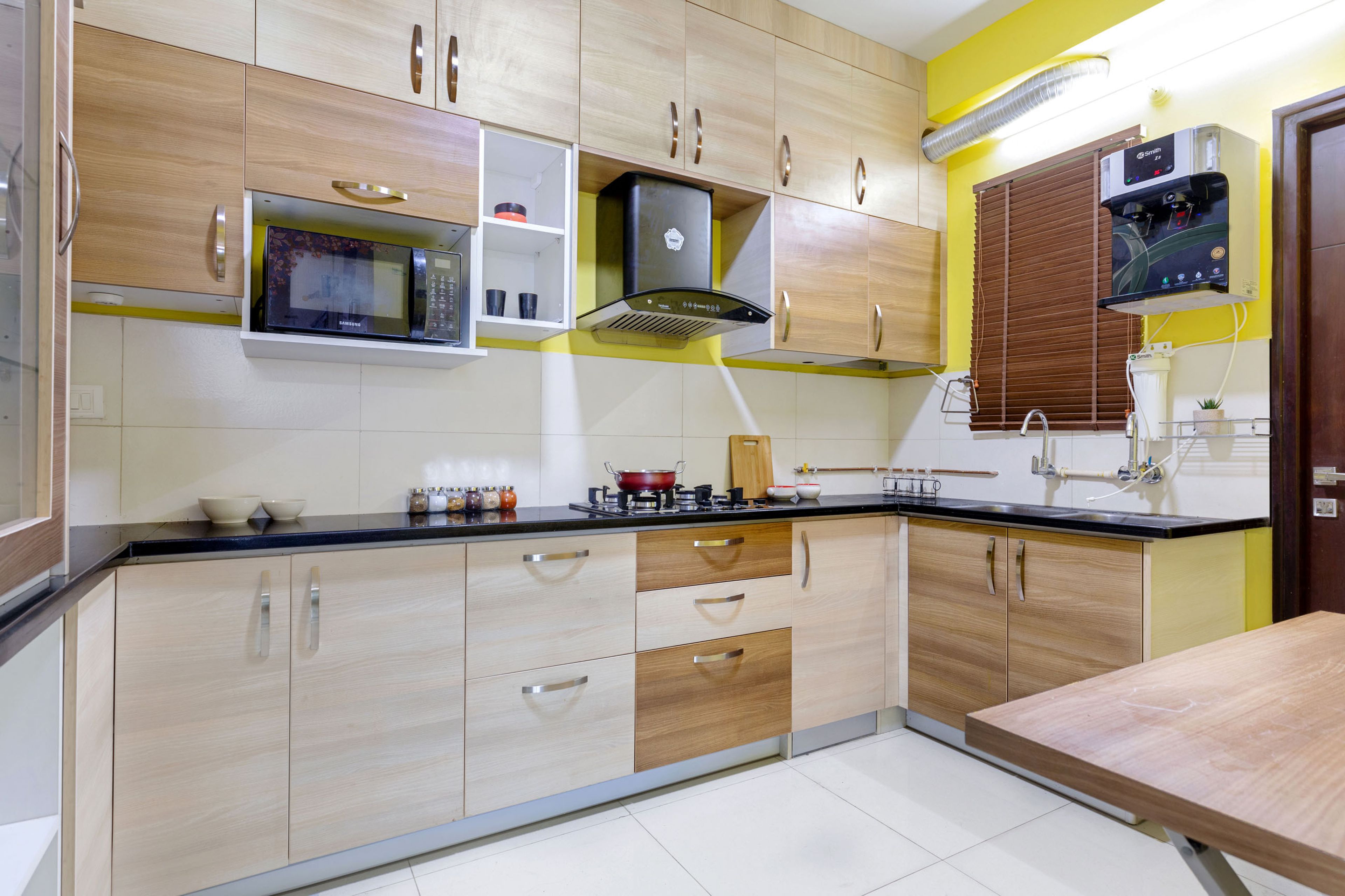 Contemporary 1-BHK Flat In Hyderabad With Wooden L Shaped Kitchen