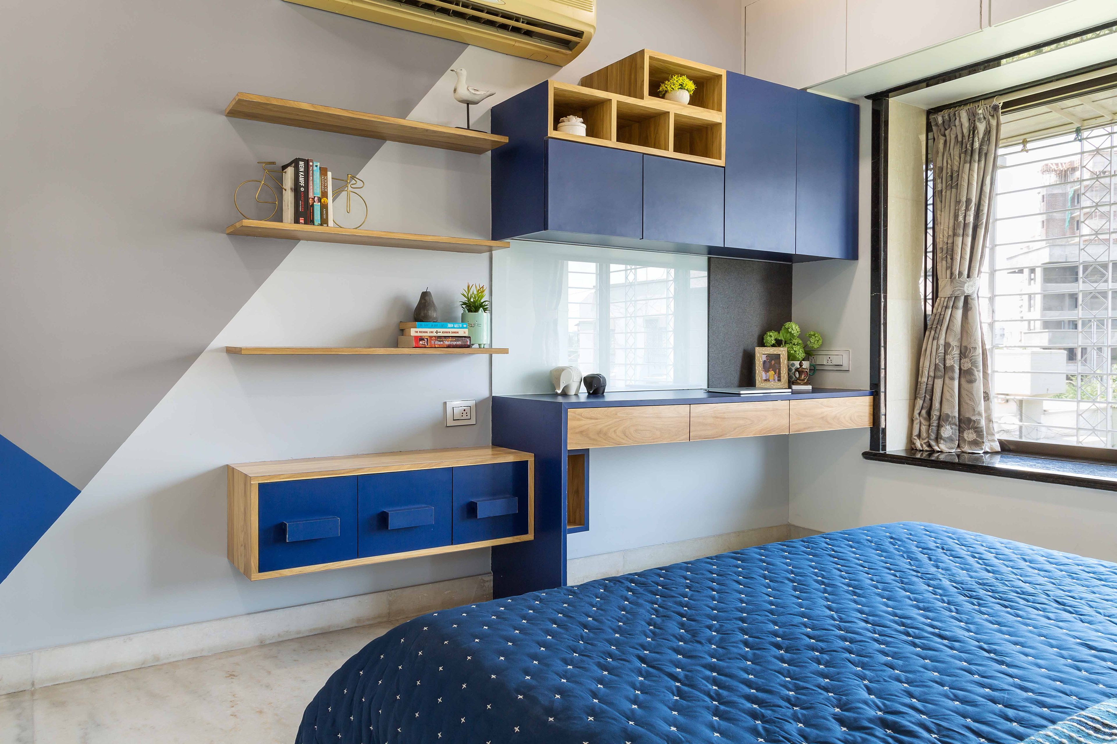 Blue And Grey Bedroom Design With White And Wood Wardrobe - Livspace